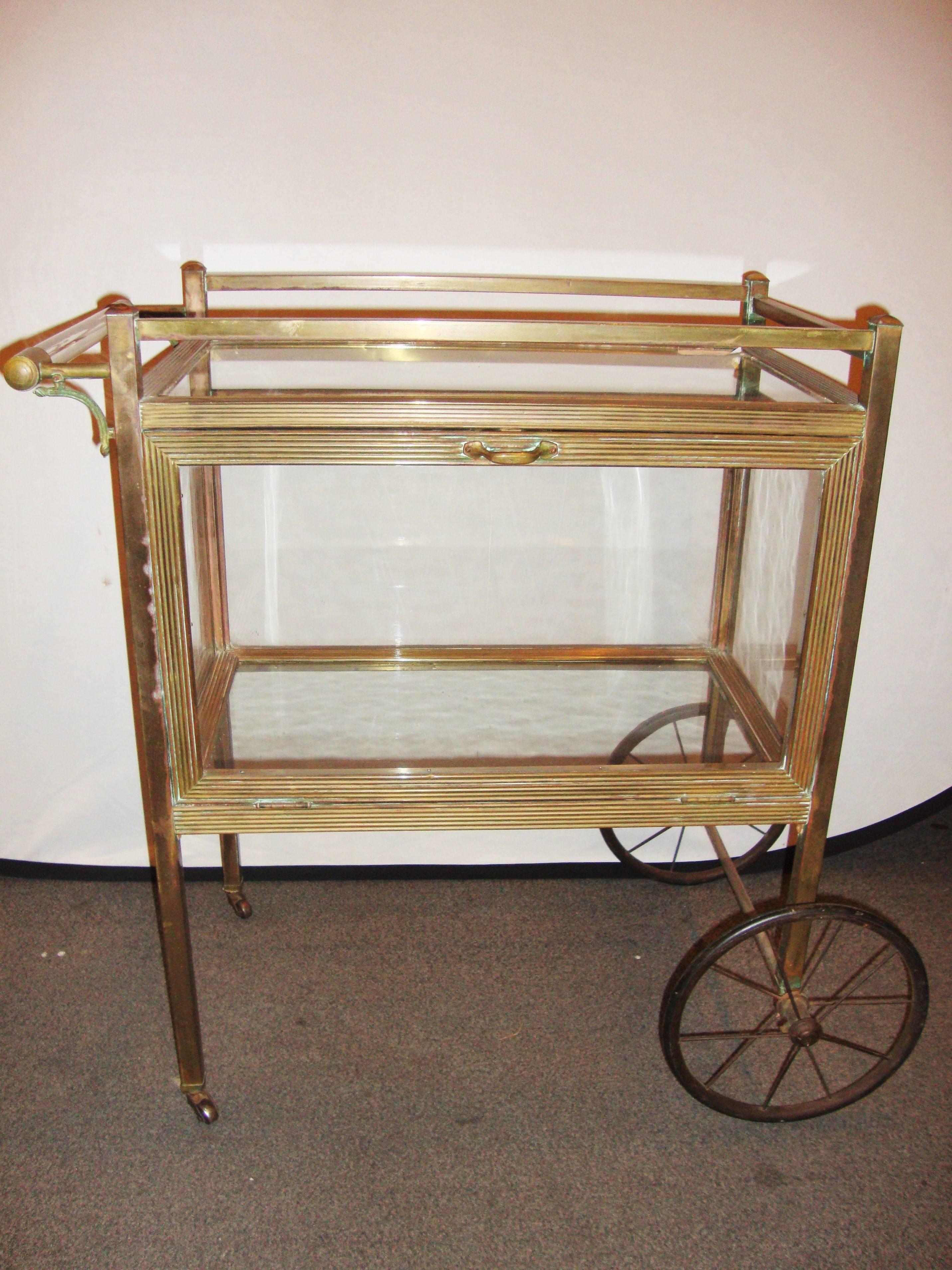 Mid-Century Modern brass and glass tea cart serving wagon.