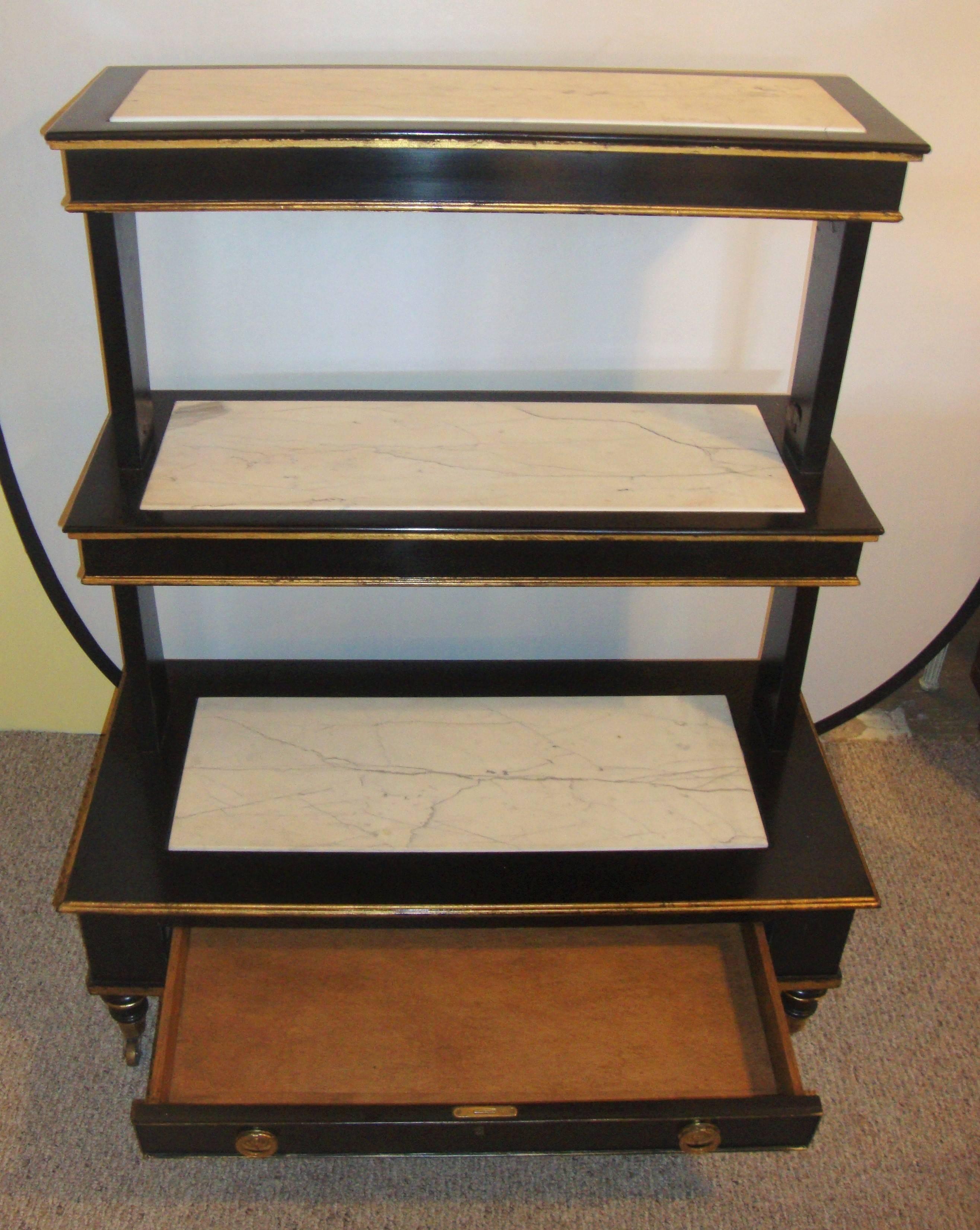 Hollywood Regency Ebonized And Gilt Three-Tier Bookshelve Dry Bar Marble Top On Each Shelf Wheels