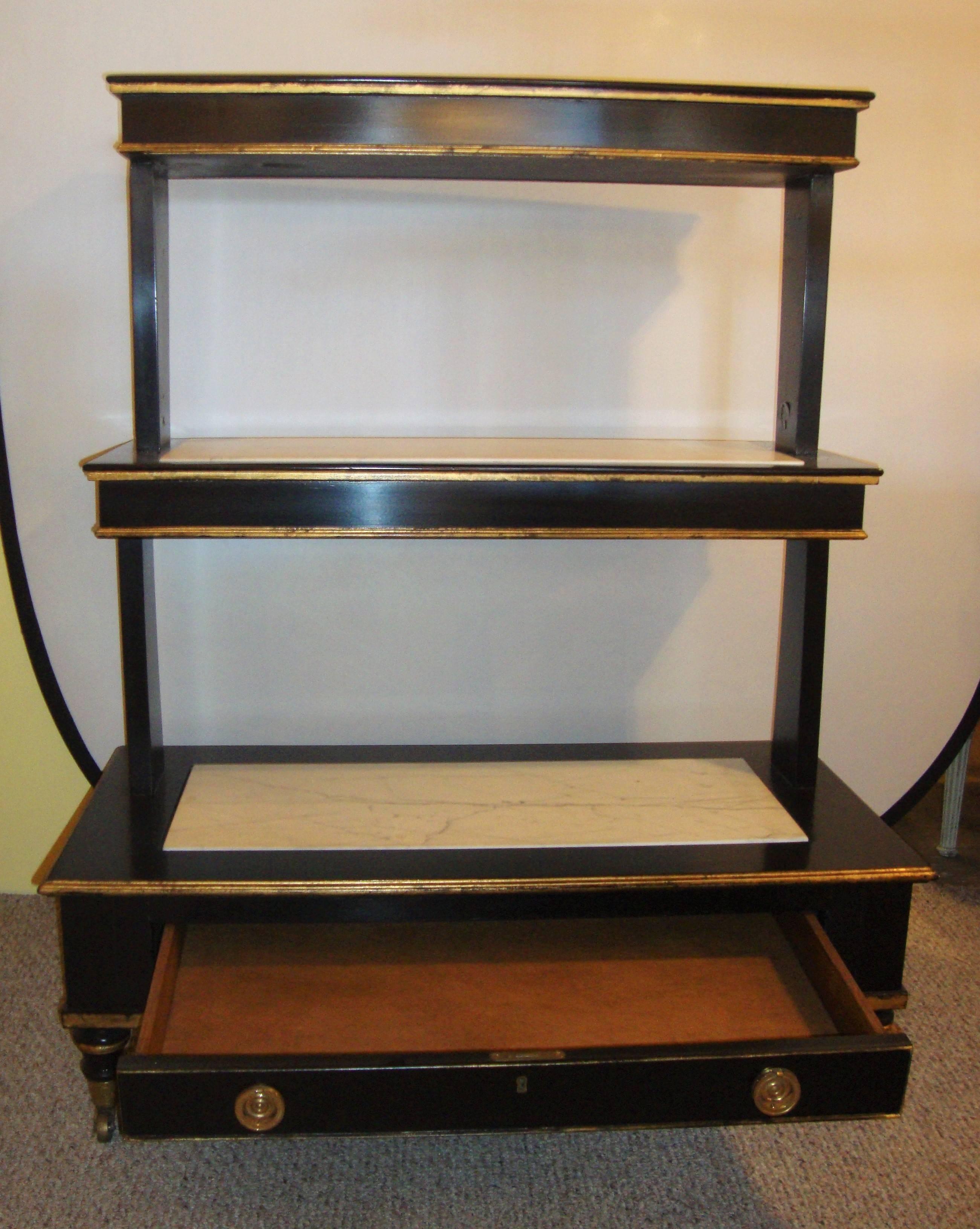 Ebonized And Gilt Three-Tier Bookshelve Dry Bar Marble Top On Each Shelf Wheels In Good Condition In Stamford, CT