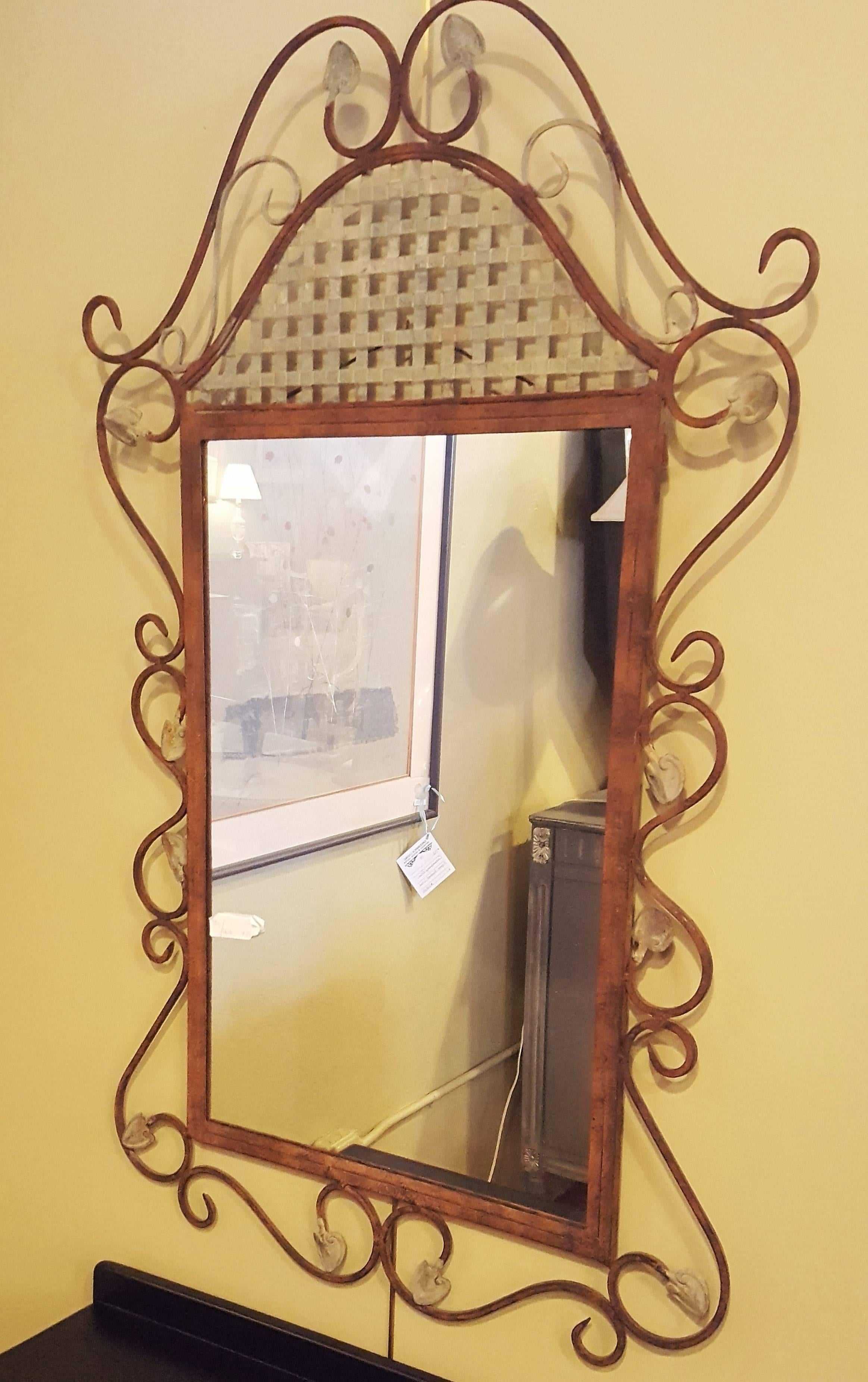 Rustic metal wall mirror. A cute and simple metal wall mirror with decorative scroll design.