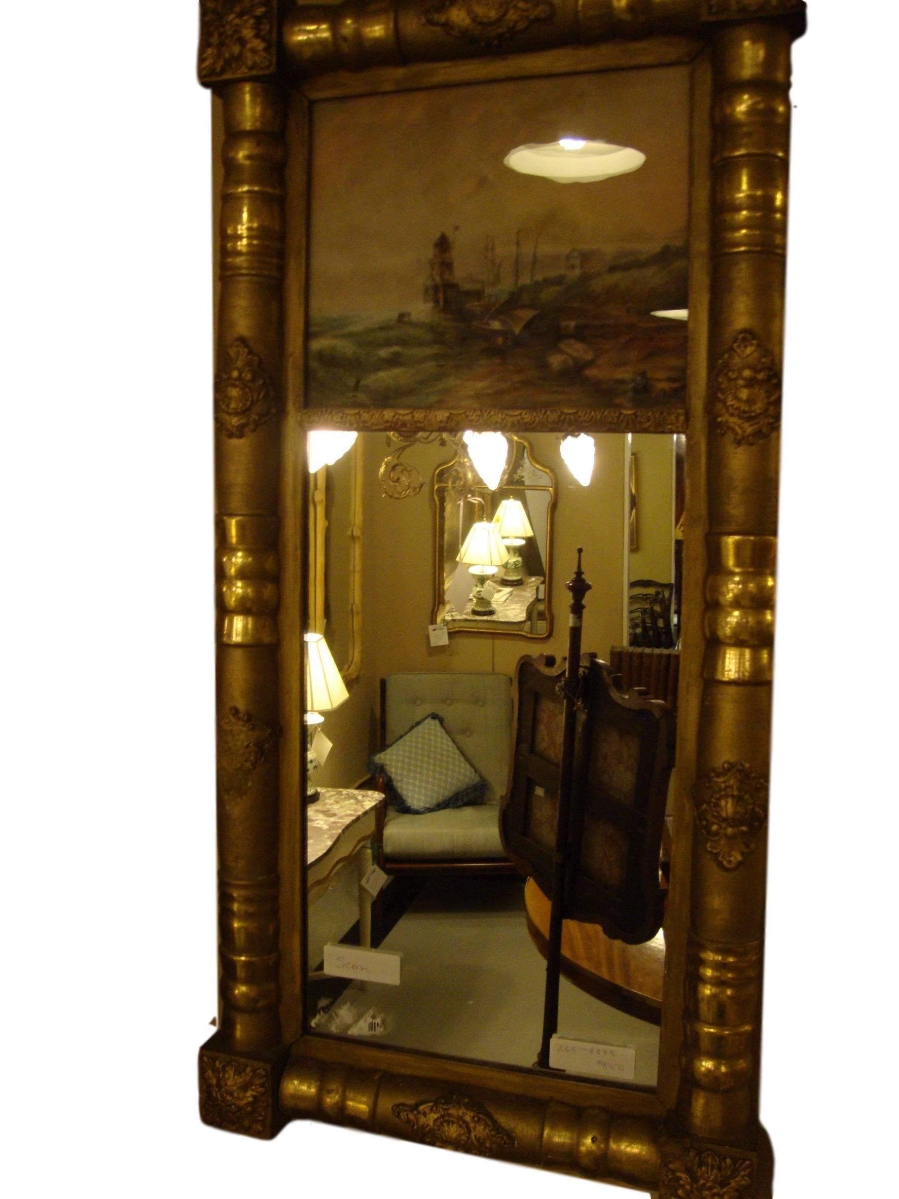 19th-20th century Federal style crest mirror. In a very fine water gilt bamboo form frame. The reflection from a hanging chandelier is what is appearing as a globe in the picture.