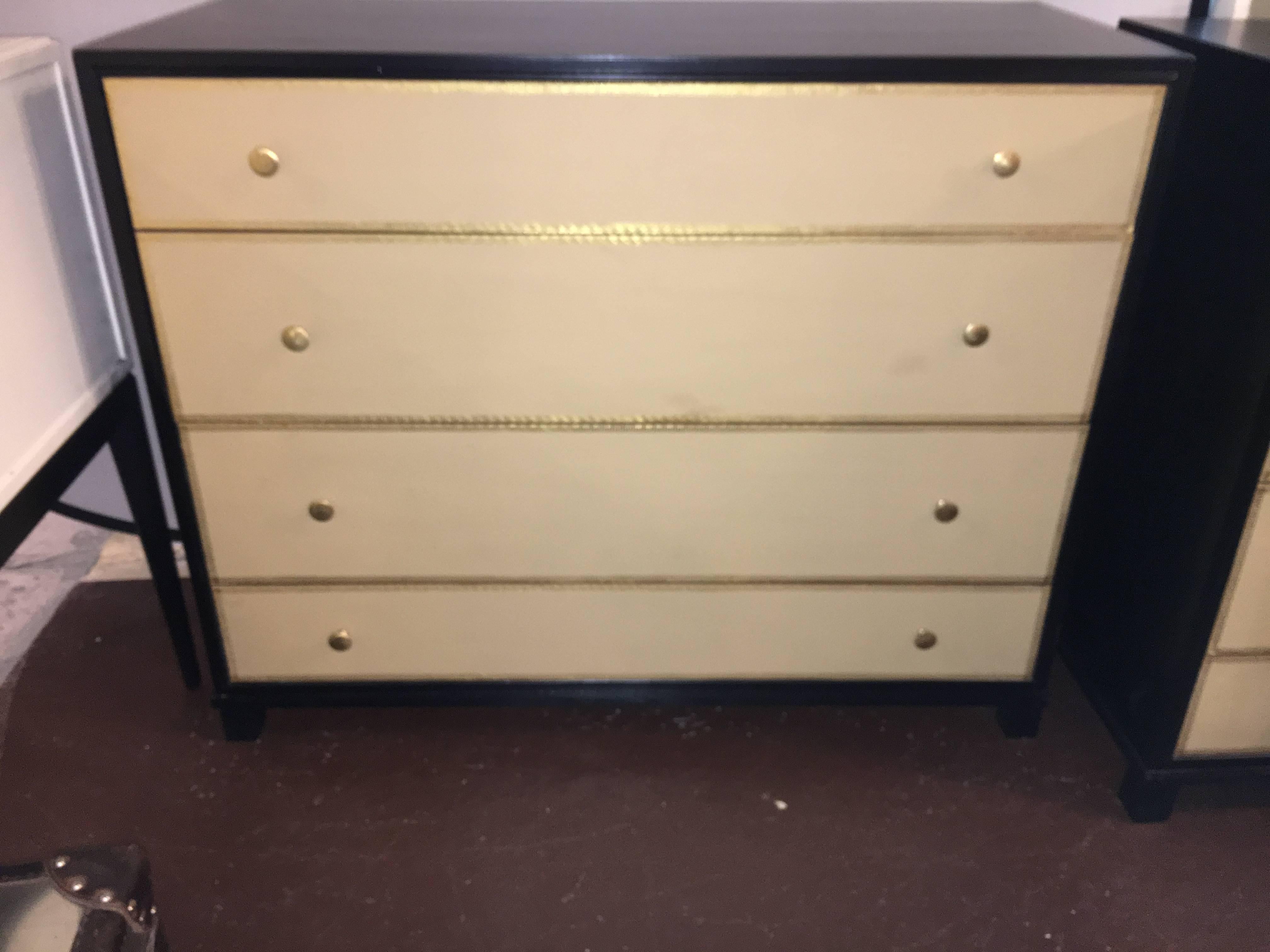 Hollywood Regency at its finest. Parzinger style large pair of leather front drawer chests. Two large center drawers flanked by thinner drawers each having leather fronts with gilt gold Greek key design. The case all handmade sitting on bracket