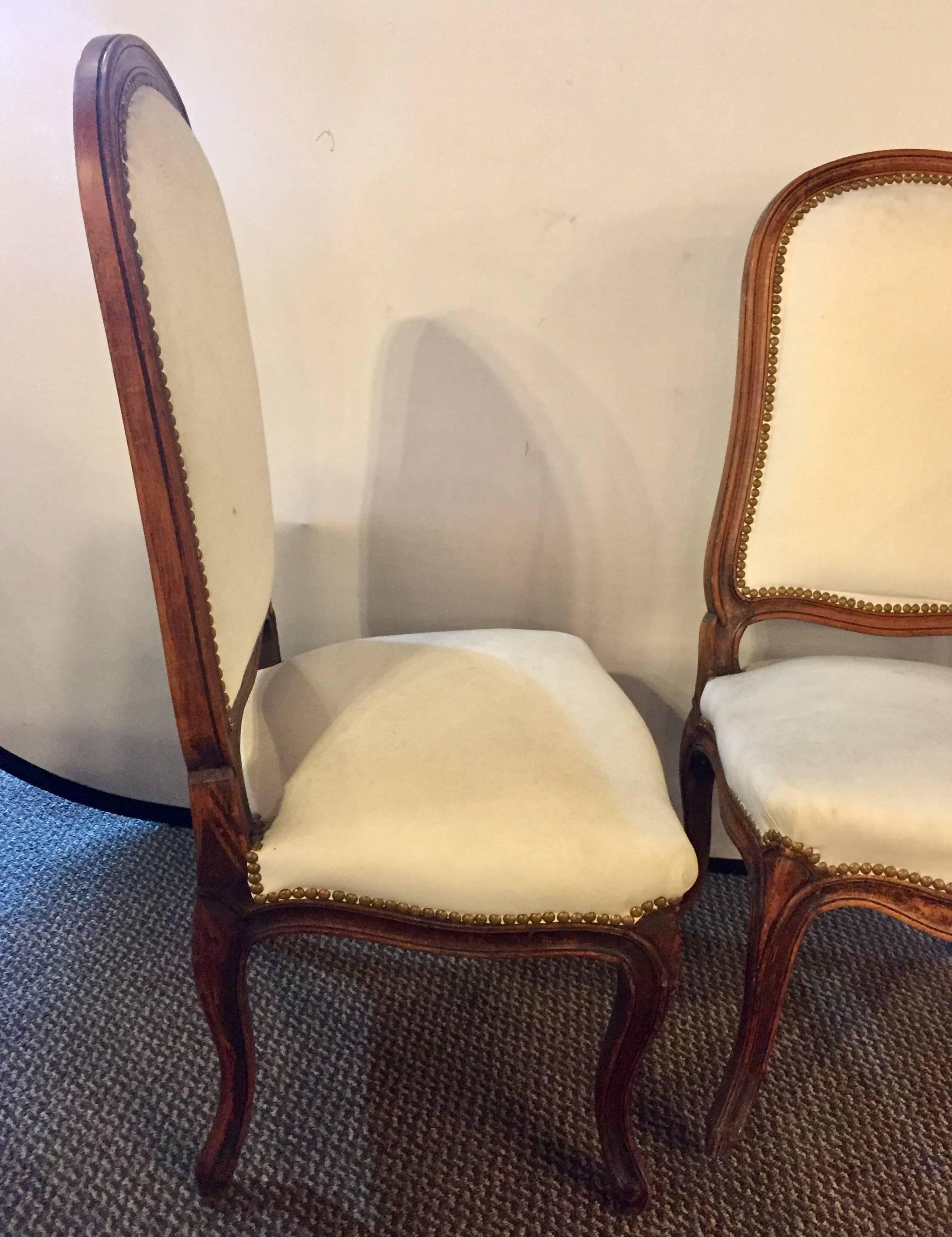 Pair of Louis XV style Maison Jansen boudoir side chairs. Pair of diminutive ladies chairs each having a mahogany frame with a Muslim fabric supported by brass tacks.