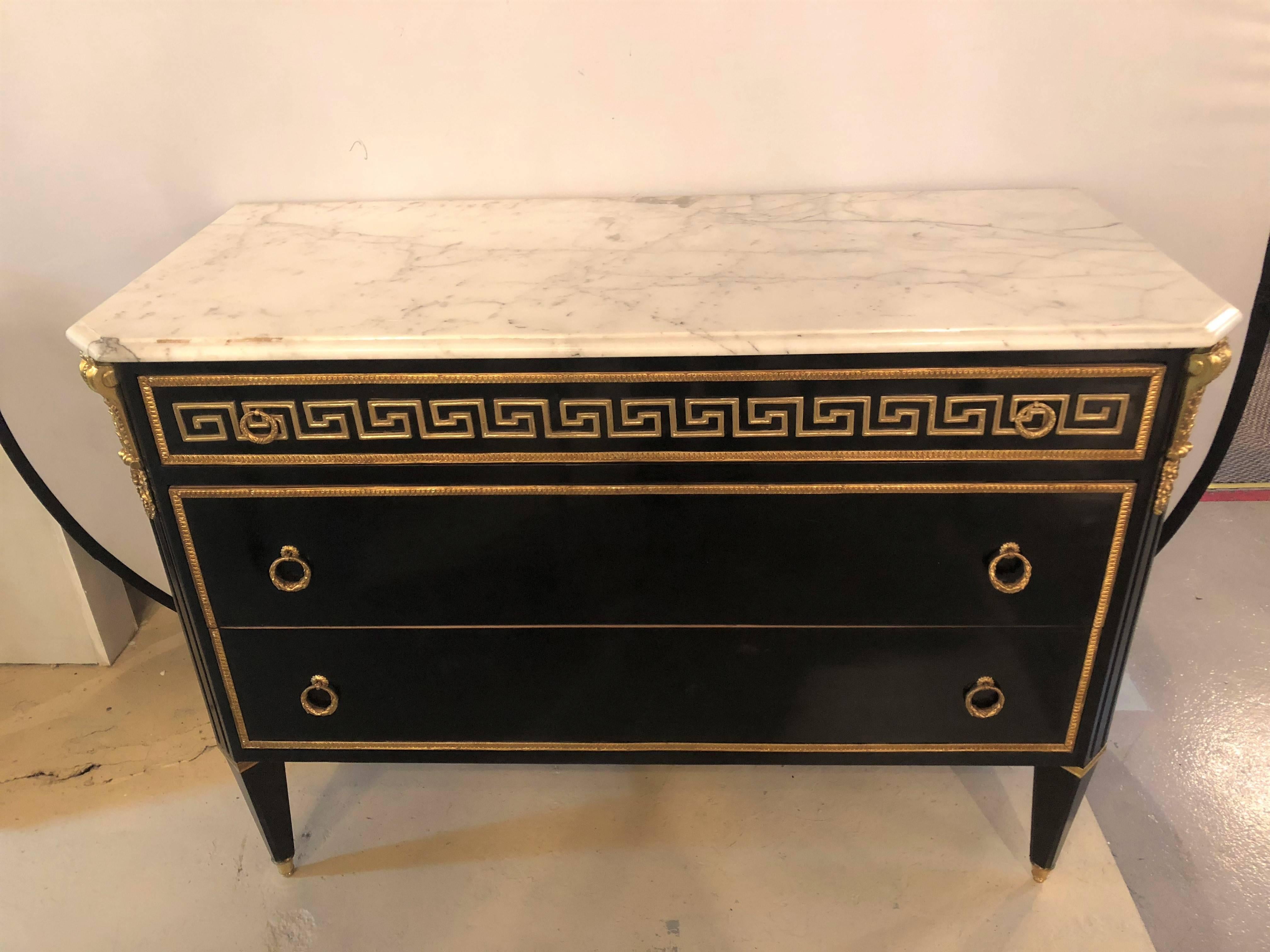Simply the finest in quality and style come this pair of Hollywood Regency style ebony bronze Greek key design commodes or nightstands in the manner Maison Jansen. 