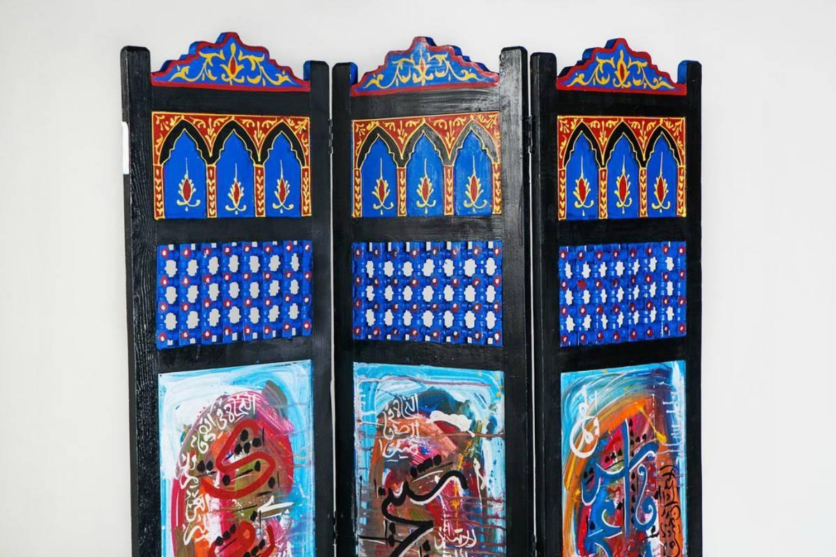 This hand-painted oasis decorative divider is the perfect way to create privacy and divide space. With vibrant colors, swirling abstract patterns and a Moorish design component, this decorative divider is a memorable addition to any living space in