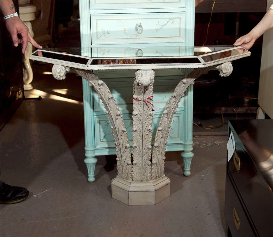 The mirrored top supported by paint decorated plume-like pedestal, supported by a block base by Jansen.