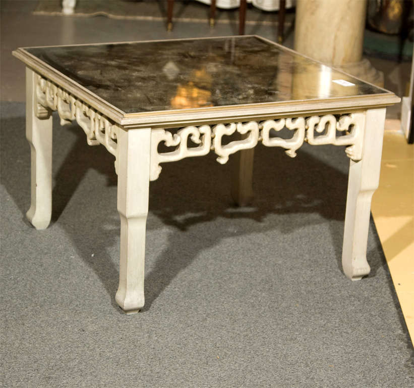 Pair of Hollywood Regency style Asian inspired painted and distressed mirror glass top square end tables stamped Jansen. Gilt gold painted edging. These stunning decorative end tables would be the perfect accent for your living space.