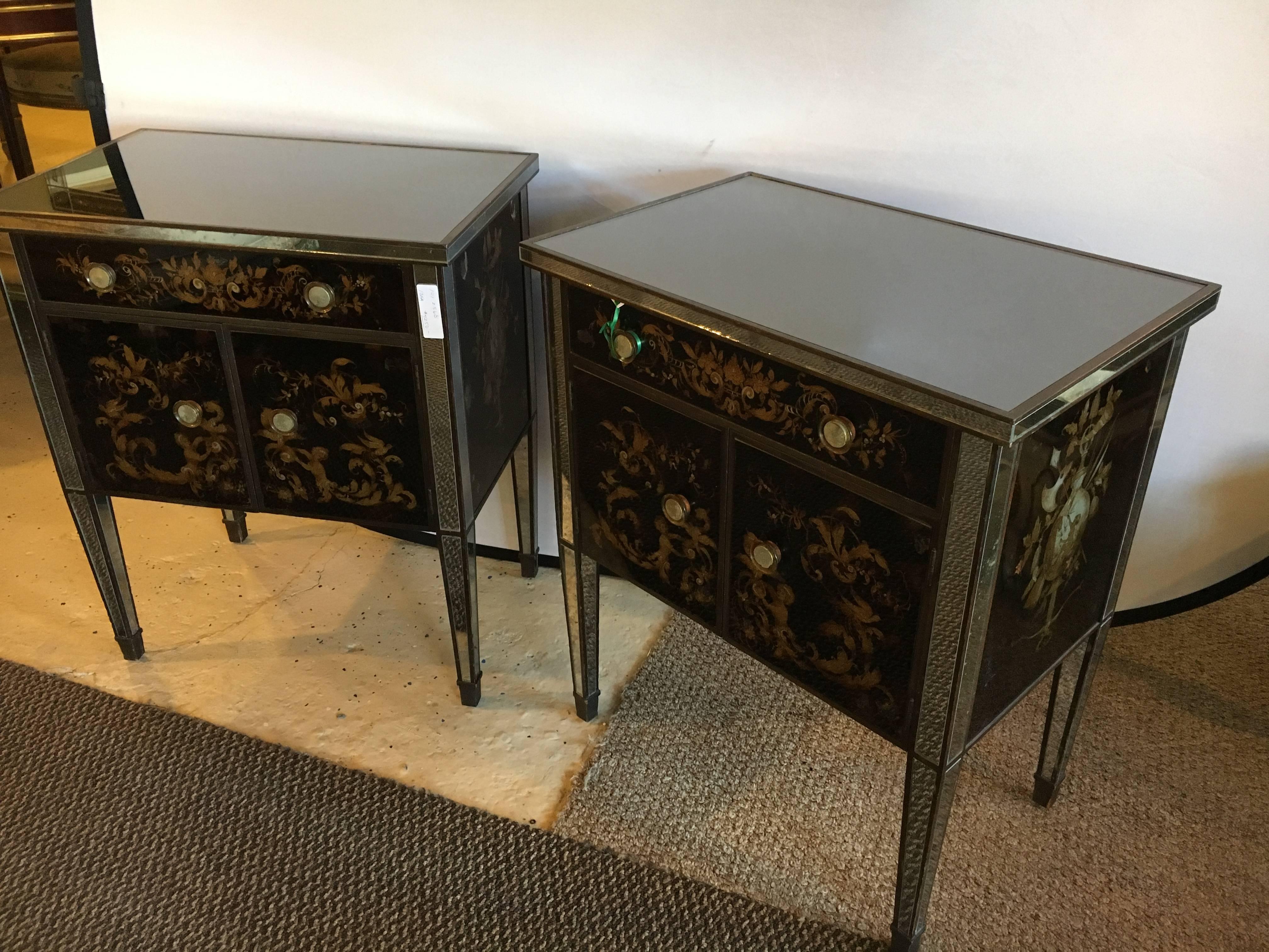 Pair of Jansen mirror and églomisé nightstands or end tables. A pair of wooden vintage case with later decorated mirrored and églomisé decorated panels. The tapering legs supporting a pair of door under a single drawer. Each distress decorated. One