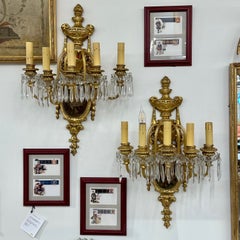 Set of Four Louis XVI Style Bronze and Crystal Rams Head Five Light Sconces