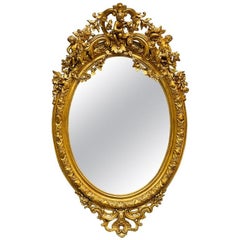 19th Century Palatial Giltwood Wall or Console Mirror Adorning Three Cherubs