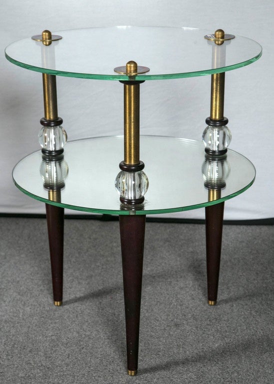 Pair Art Deco Glass & Mirror End Tables Mid-Century Modern. This fine decorative pair of end tables have mahogany tapering legs leading to a bottom circular glass shelf which sits on a crystal ball having top and bottom mahogany circular caps. The