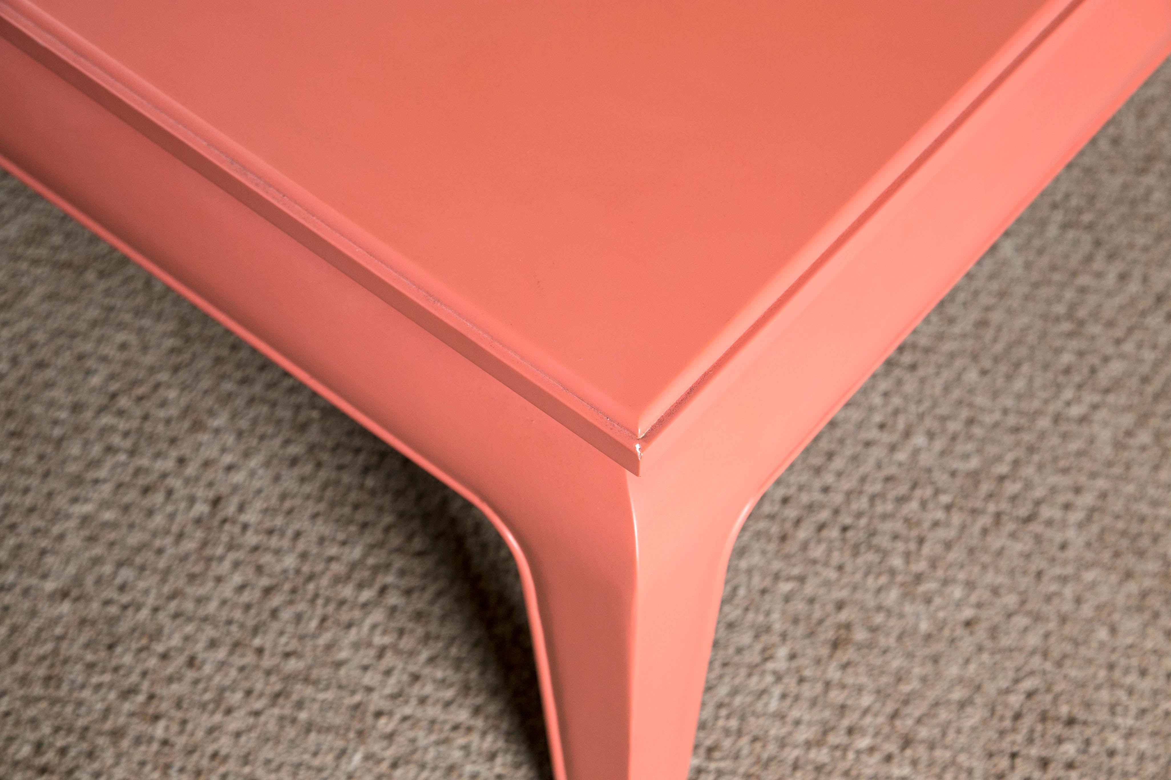 Ralph Lauren brook street cocktail table. Versatile cocktail table with a great salmon color. This piece was designed for a beach theme or a mansion on a hill. Adding color and solid structure to an everyday piece. Ralph Lauren Brook Street cocktail