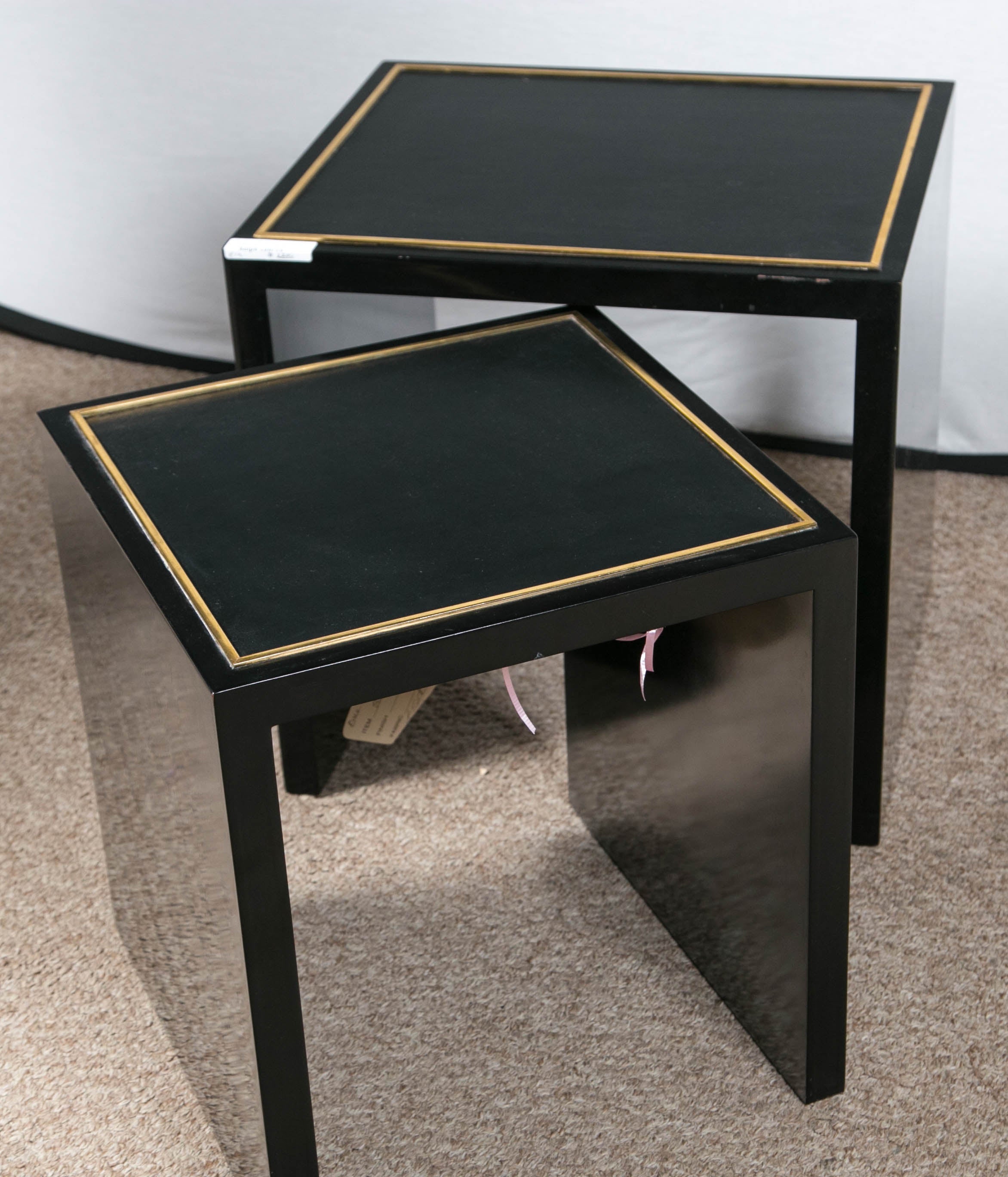 Ralph Lauren by E J Victor set of lacquered nesting tables. The ebony and brass inlaid wood tables having a leather top surface. Small table H 17.50, W 16, D 16.50 retails at $3,765 at Ralph Lauren Home.

Recently acquired from a container purchased