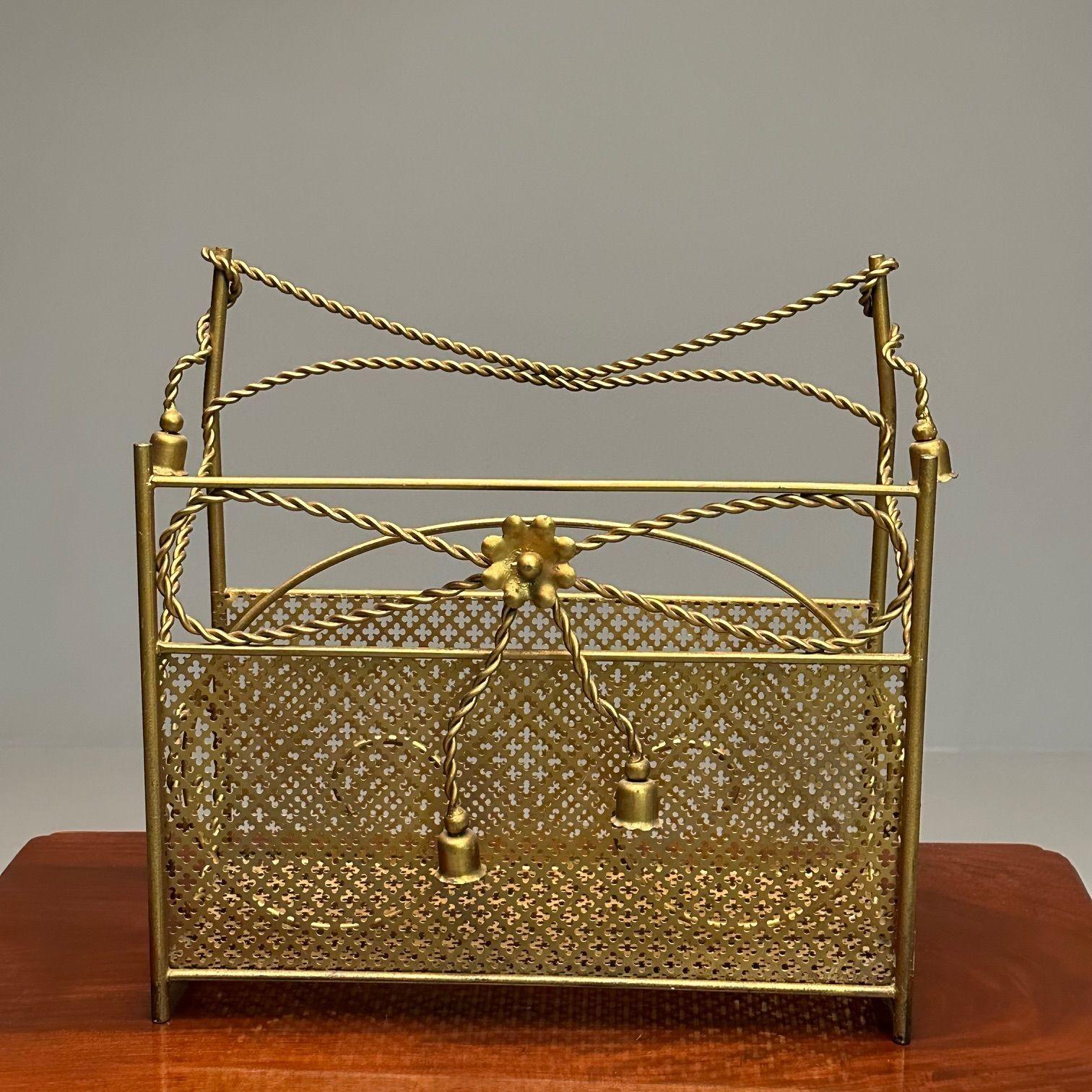 Hollywood Regency Gilt Bronze Magazine Rack, Rope an Tassel Form

The case having sections in a mesh brass design.

Height: 17