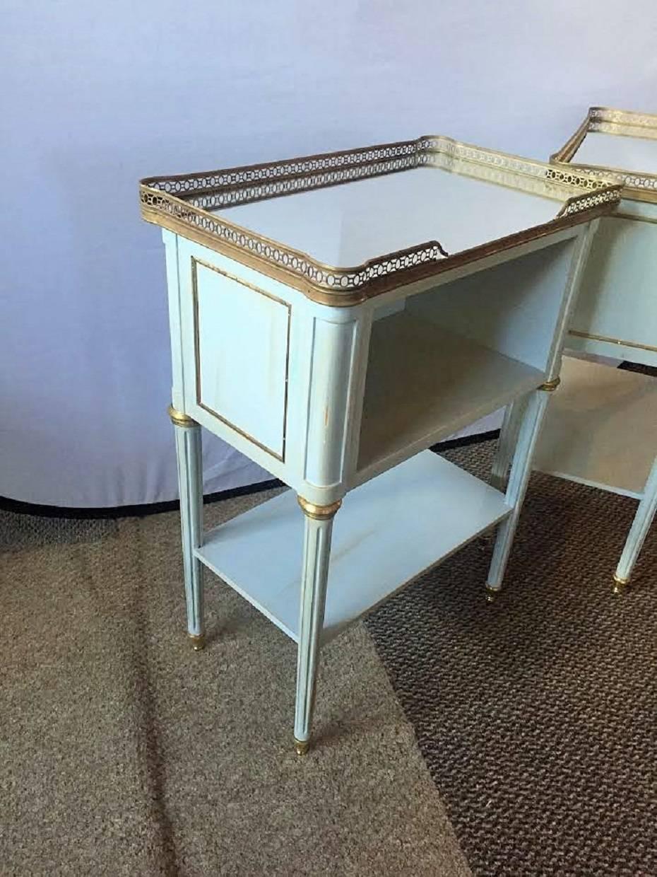 Pair of fine Maison Jansen Style paint decorated end tables. Mirrored galleried tops. Fine pair with open cabinet fronts in the Louis XVI style.