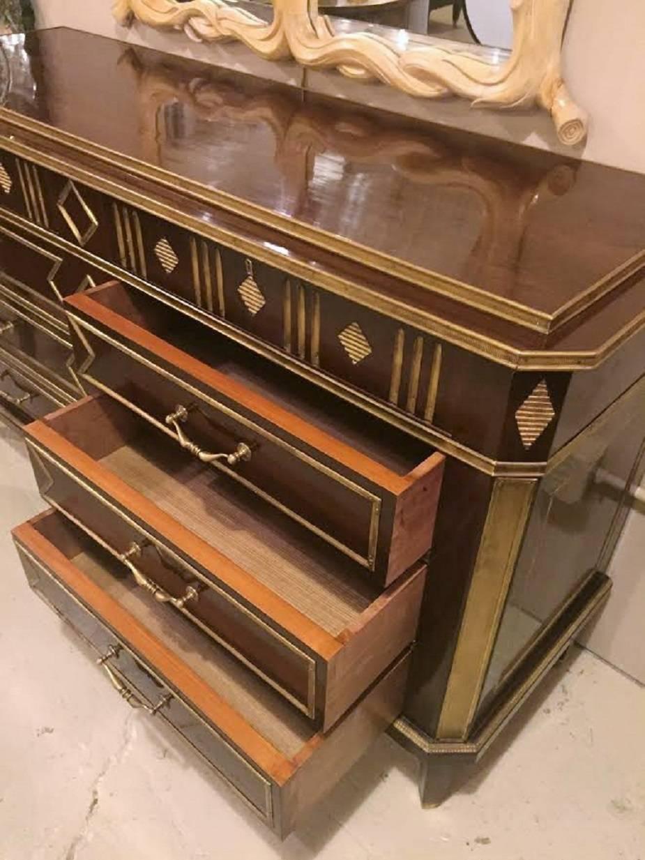 A beautiful pair of Russian step up neoclassical style, four by four drawer chest or commodes in the Louis XVI fashion. Monumental in size each sitting over five feet wide, polished and restored. This one of a kind pair of extra large chests or