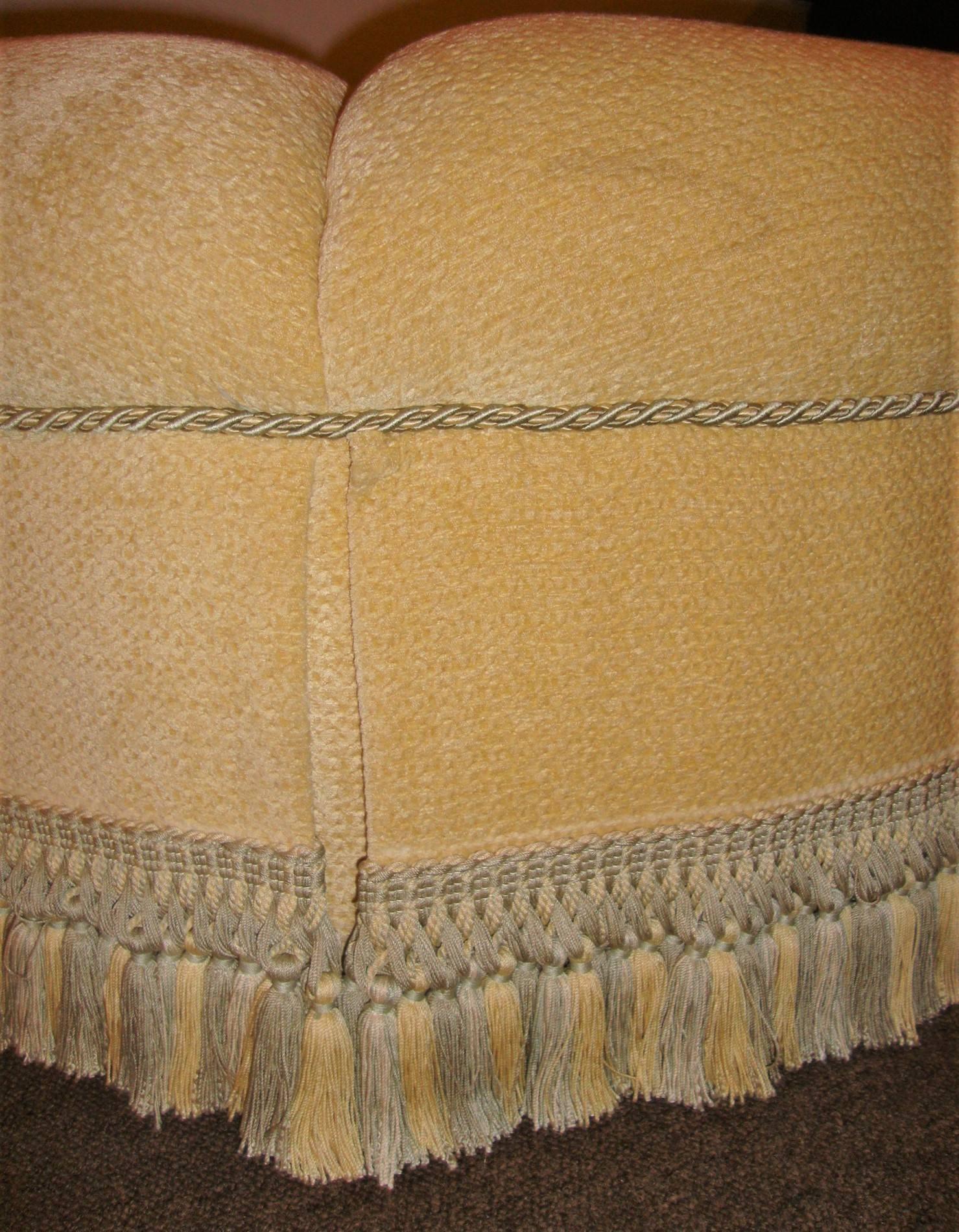 round tufted ottoman with fringe