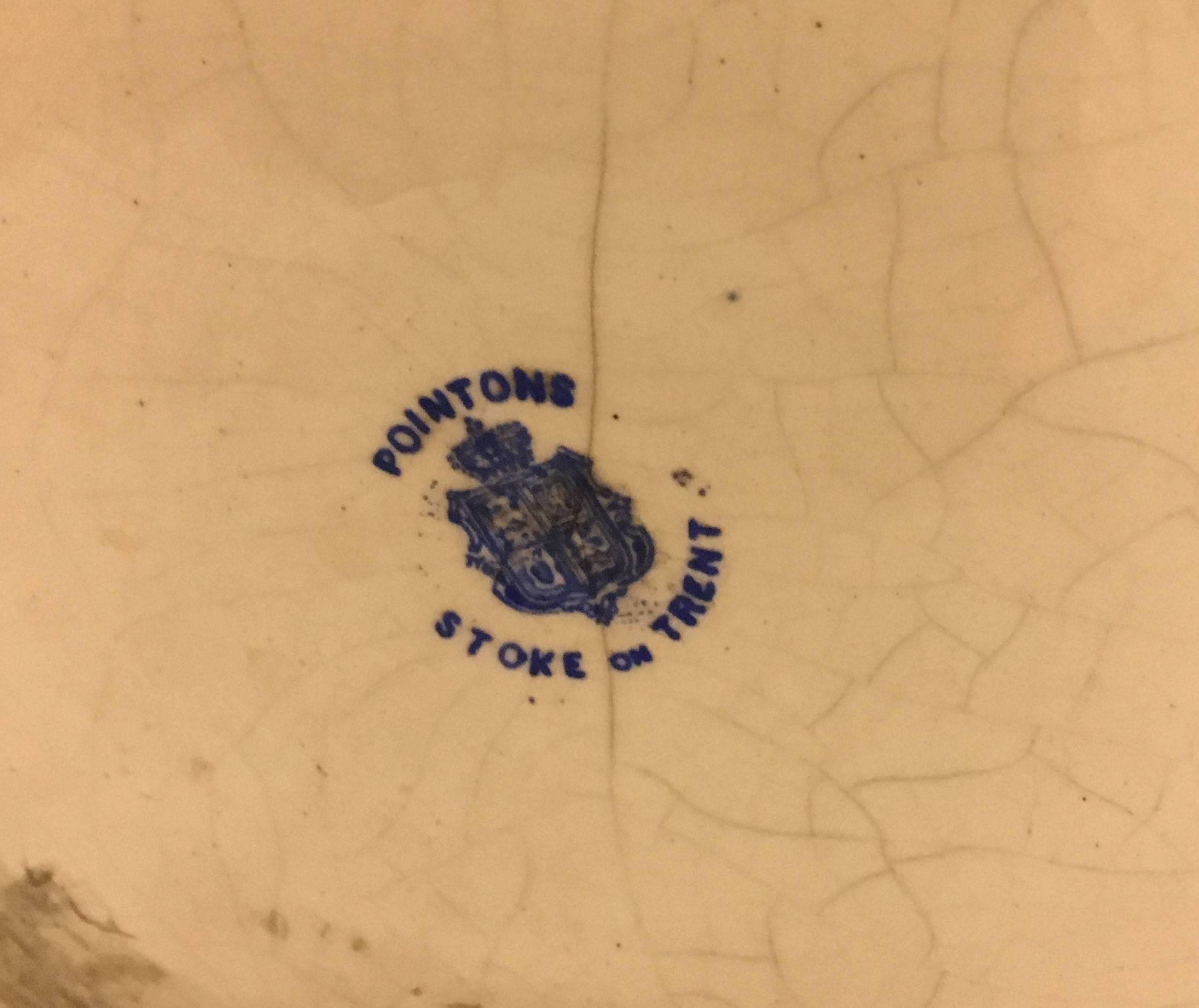 A large pottery vase signed Pointons, Strokes-on-Trent. Beautiful rose vine pattern. Bearing the 1883 Logo.

Pointon & Co Ltd. (Formerly R G Scrivener & Co.) Norfolk Street Works, Hanley, Stoke-on-Trent, were manufacturers of fine artistic pottery