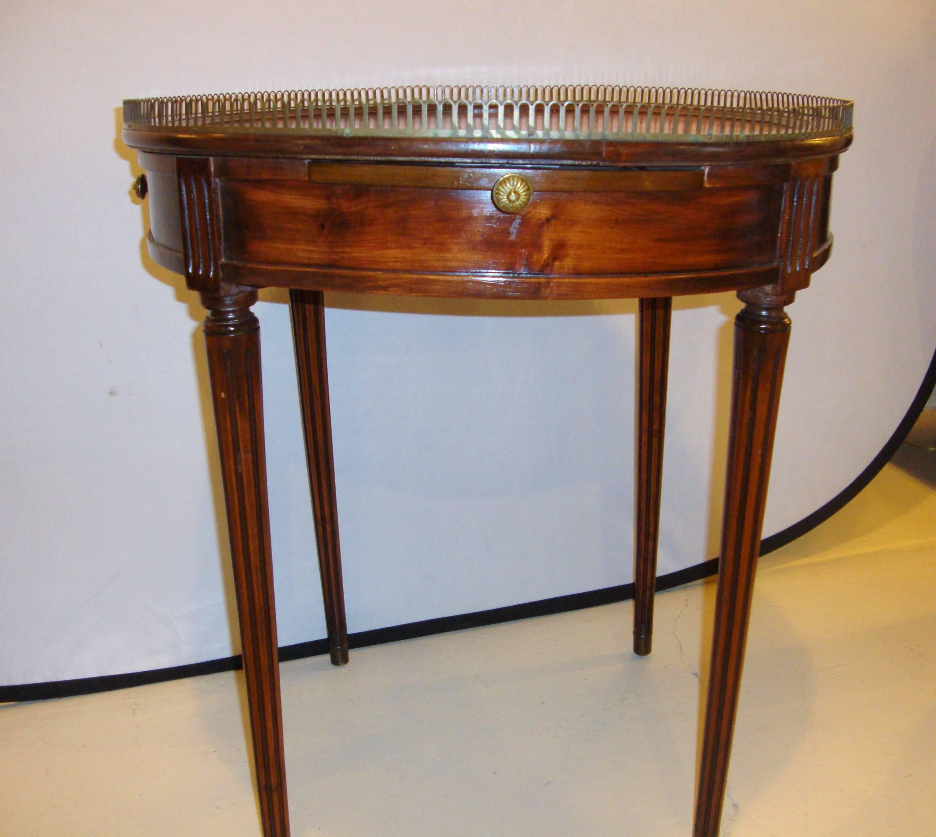 Bronze galleries mahogany circular center end table. Length of pull-out sides = 8 inches.
