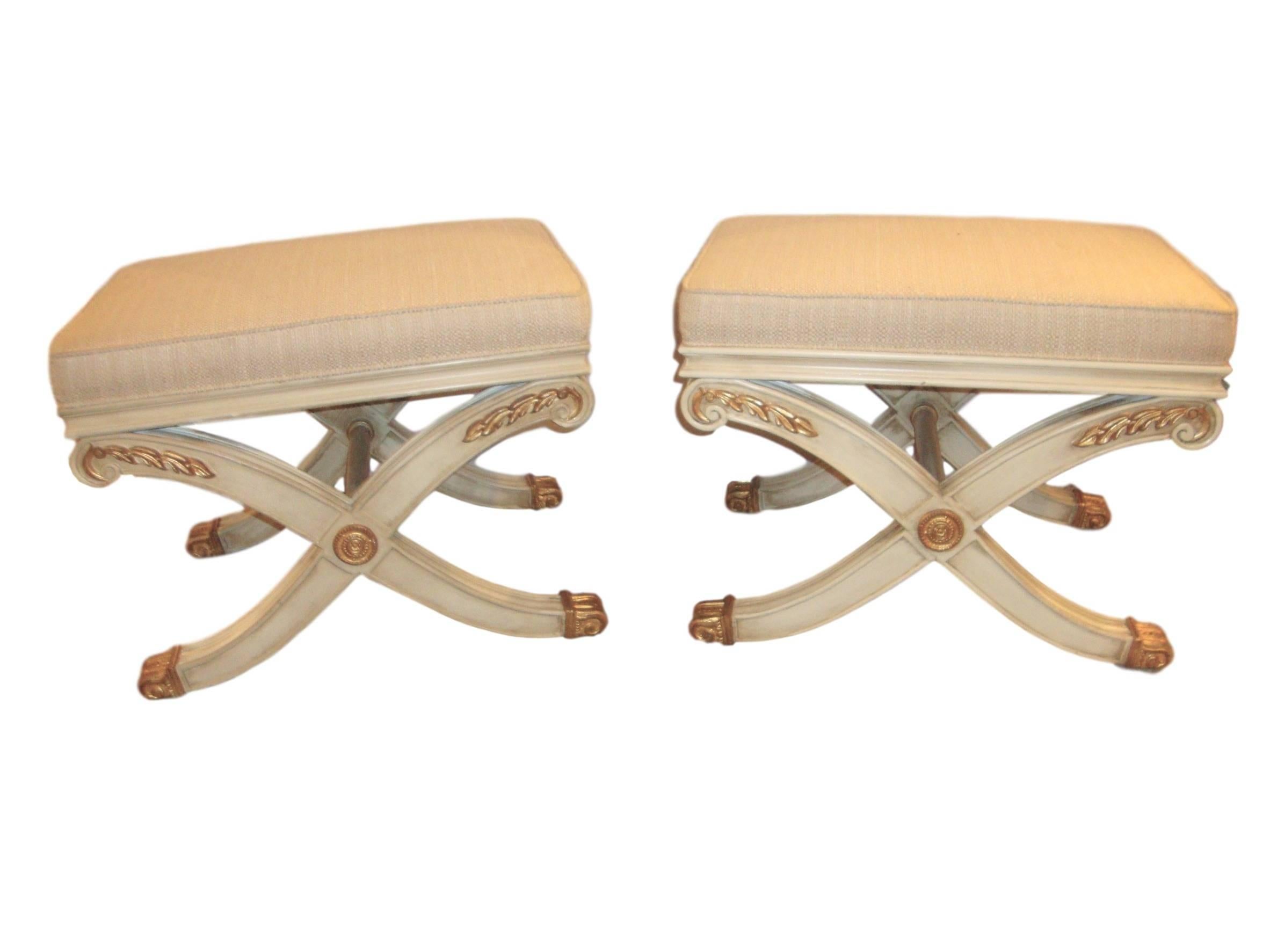 Pair of Maison Jansen style X-form benches. Pair of parcel-gilt and paint decorated X-shaped benches or footstools in the manner of Maison Jansen.