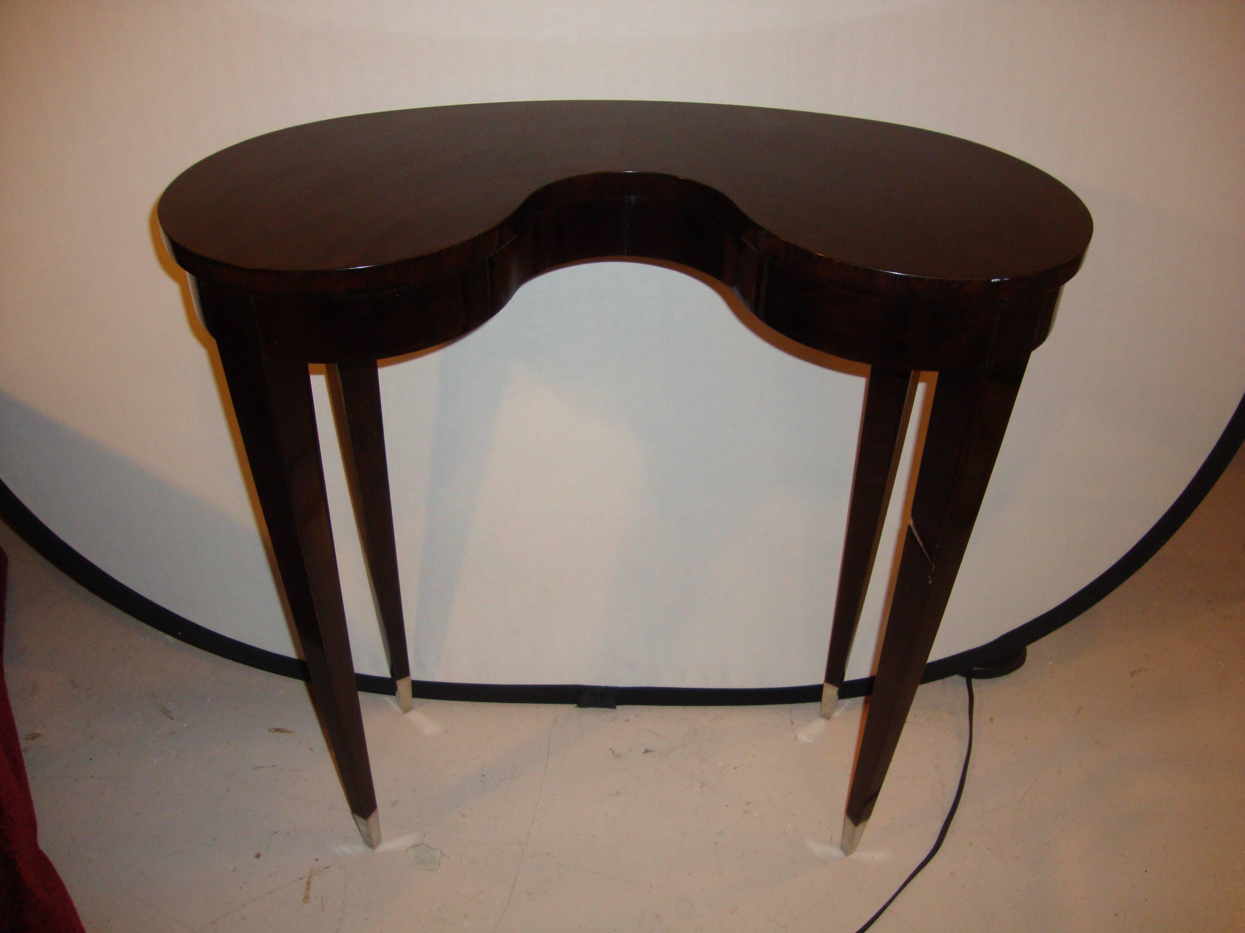 Jonathan Charles kidney shaped end table. Sheen black eucalyptus and stainless steel caps to the feet. Belgravia coll.