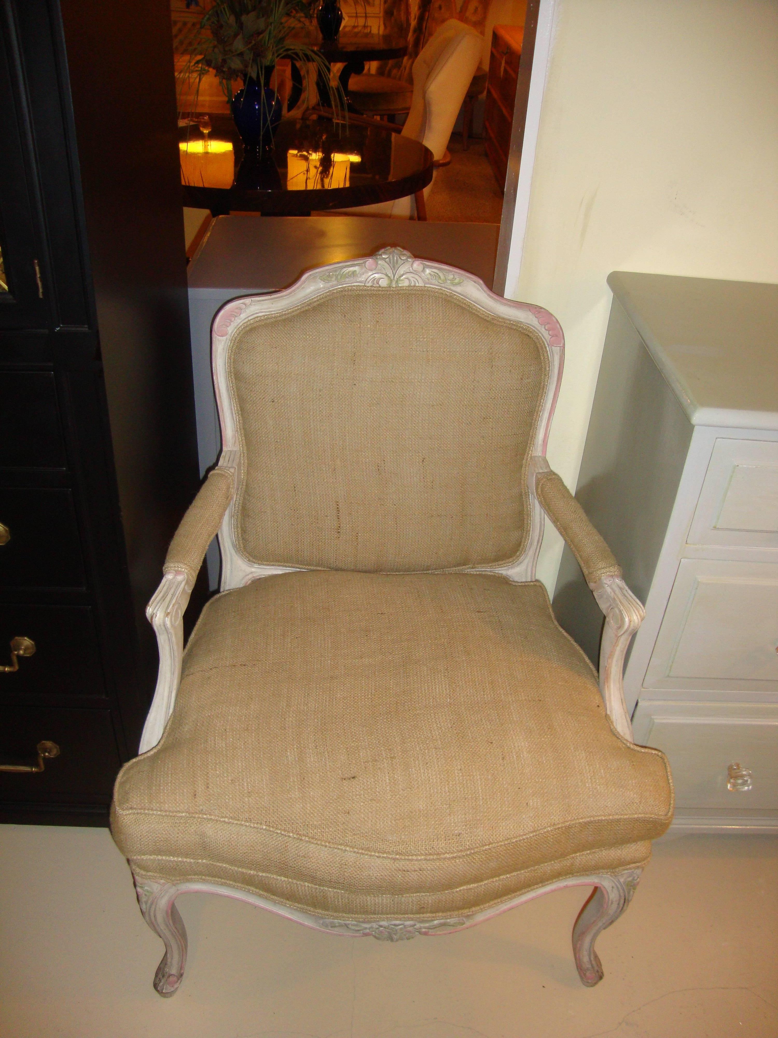 A Louis XVI style paint decorated armchair. This finely carved armchair is fashioned in the Louis XV style and is finely paint decorated. This chair comes with a matching footstool that is sold separately. The footstool sold at $700.

Measures: