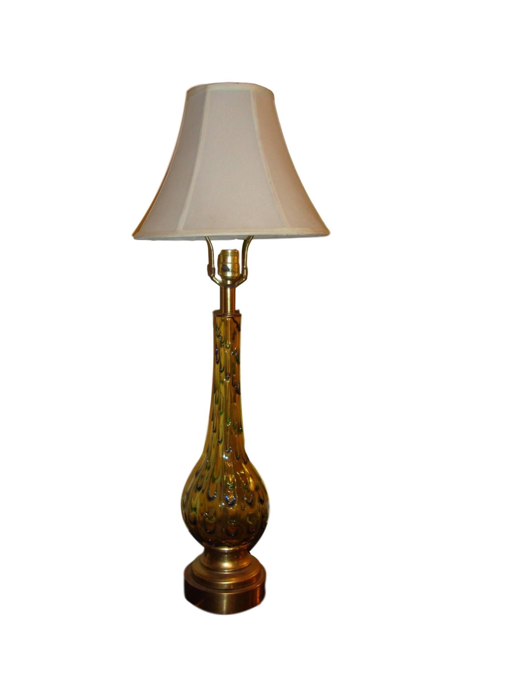 Pair of multicolored Murano glass table lamps. Each bulbous form base lamp leading to a long neck stem supporting a lampshade. Both on brass based. Having green, yellow, blue and a tinge of orange these lamps are not only stylish and decorative but