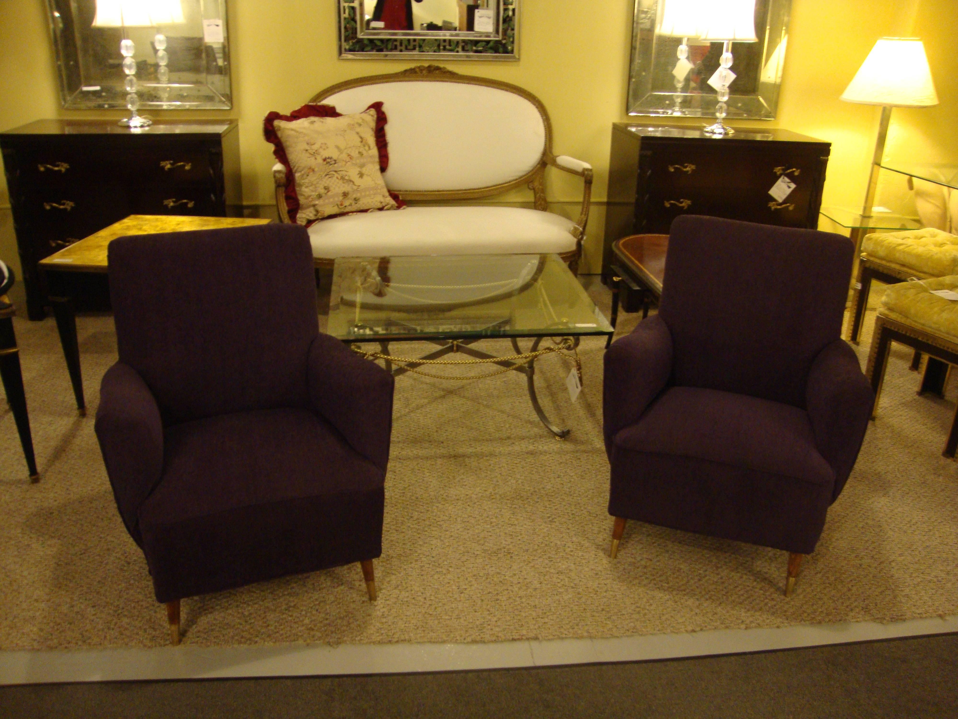 Pair of Gio Ponti style Mid-Century Modern armchairs. Each of these Italian arm or lounge chairs having brass sabots and frames which sport new fabric.
Measures:
Seat height 15.5 inches.