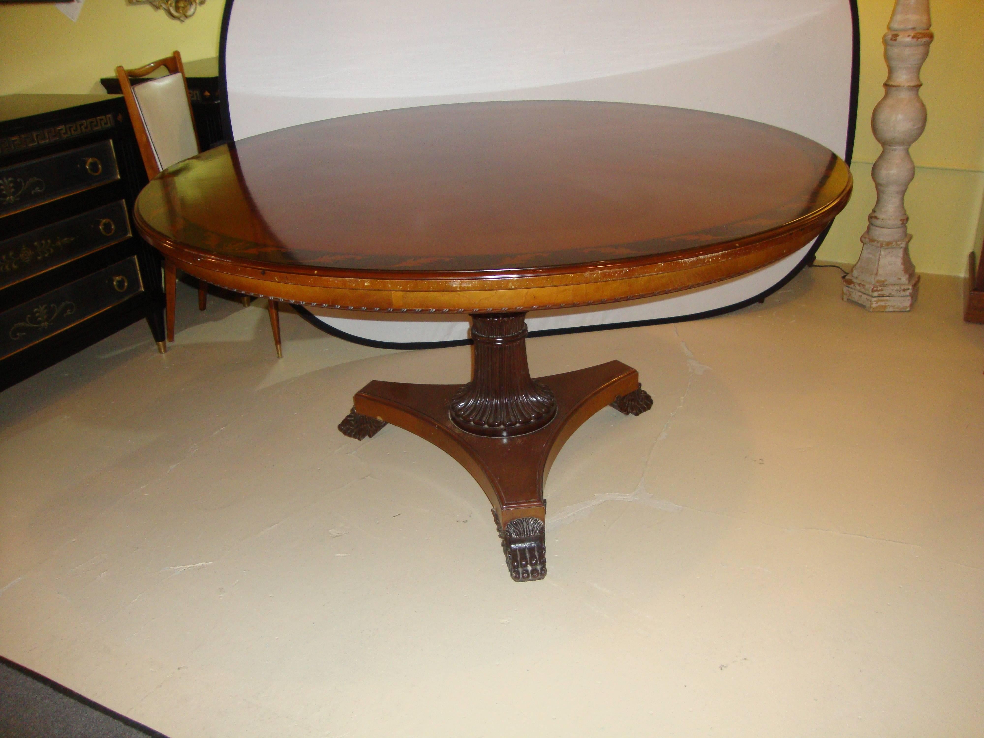 Regency style center or dining table ebony and burl woods. This fine table coming directly out of the Garden City Long Island Mansion of one of the leading Spinal Surgeons in the country. Possibly by Maitland-Smith with a walnut top having ebony