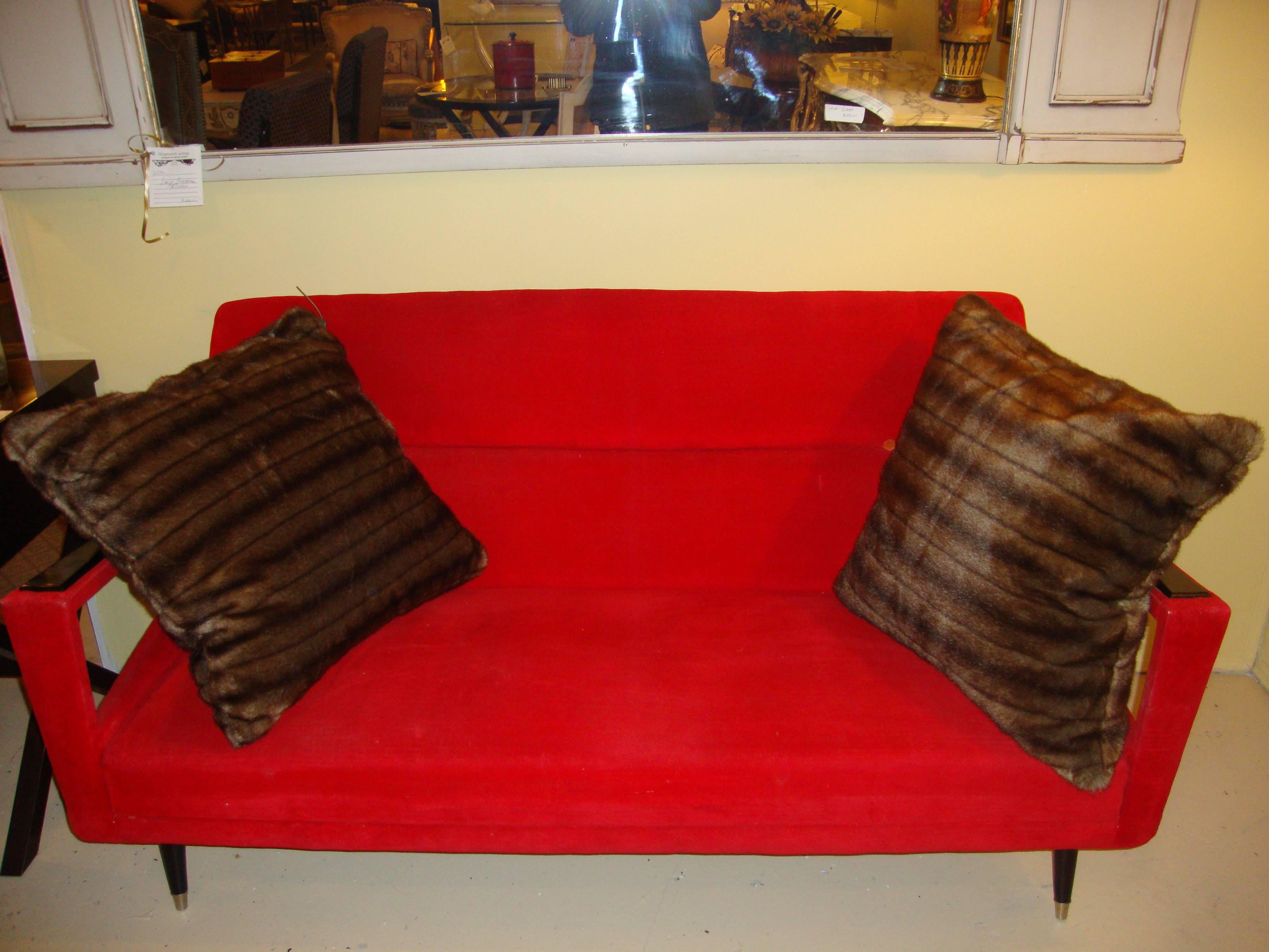 An Italian Gio Ponti style settee in new flame red upholstery. On tapering legs with bronze sabots supporting an upper frame with wood armrests. 

Measures: Seat height 16 inches.