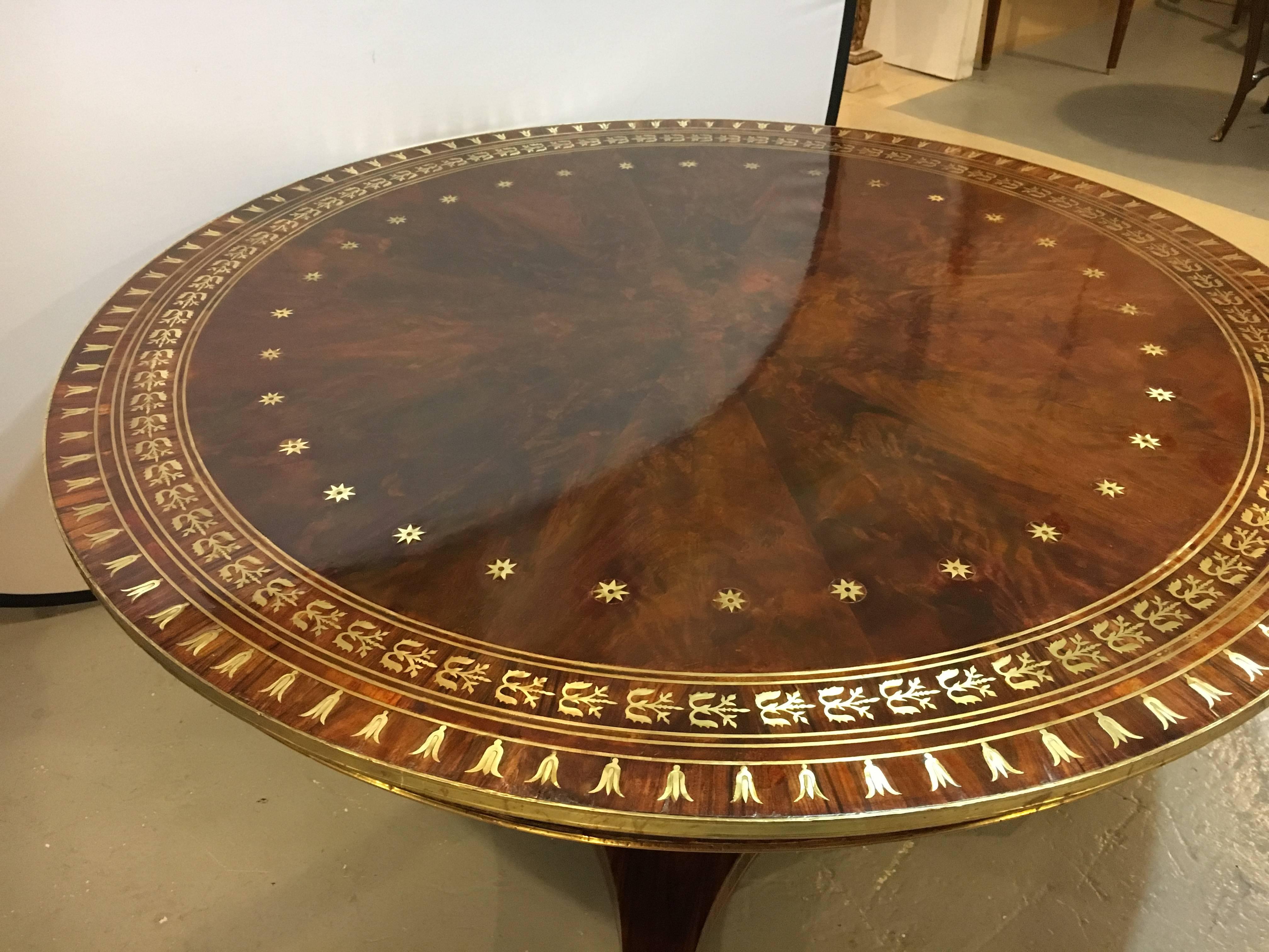 Russian neoclassical boule inlaid centre tilting table. Simply the best one has to offer. This fine late 19th-early 20th century Russian Inspired centre table appears to be solid rosewood with brass (boule) inlays of flame design. The palatial gilt