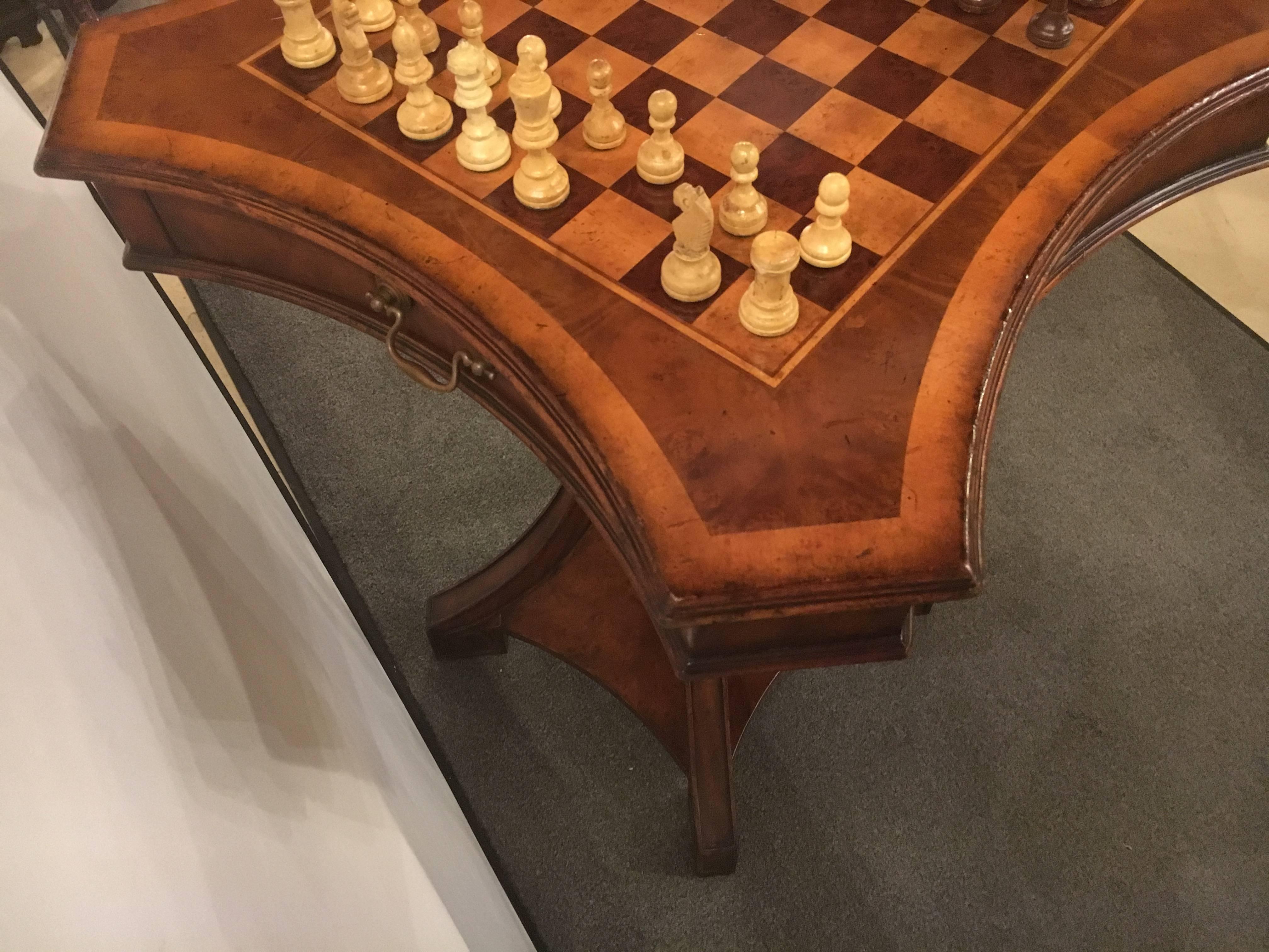 A Jonathon Charles Chess games table. Missing one bishop this spectacular stylish games table has one oak interior drawer and stands in fine condition. Inlaid and handmade.