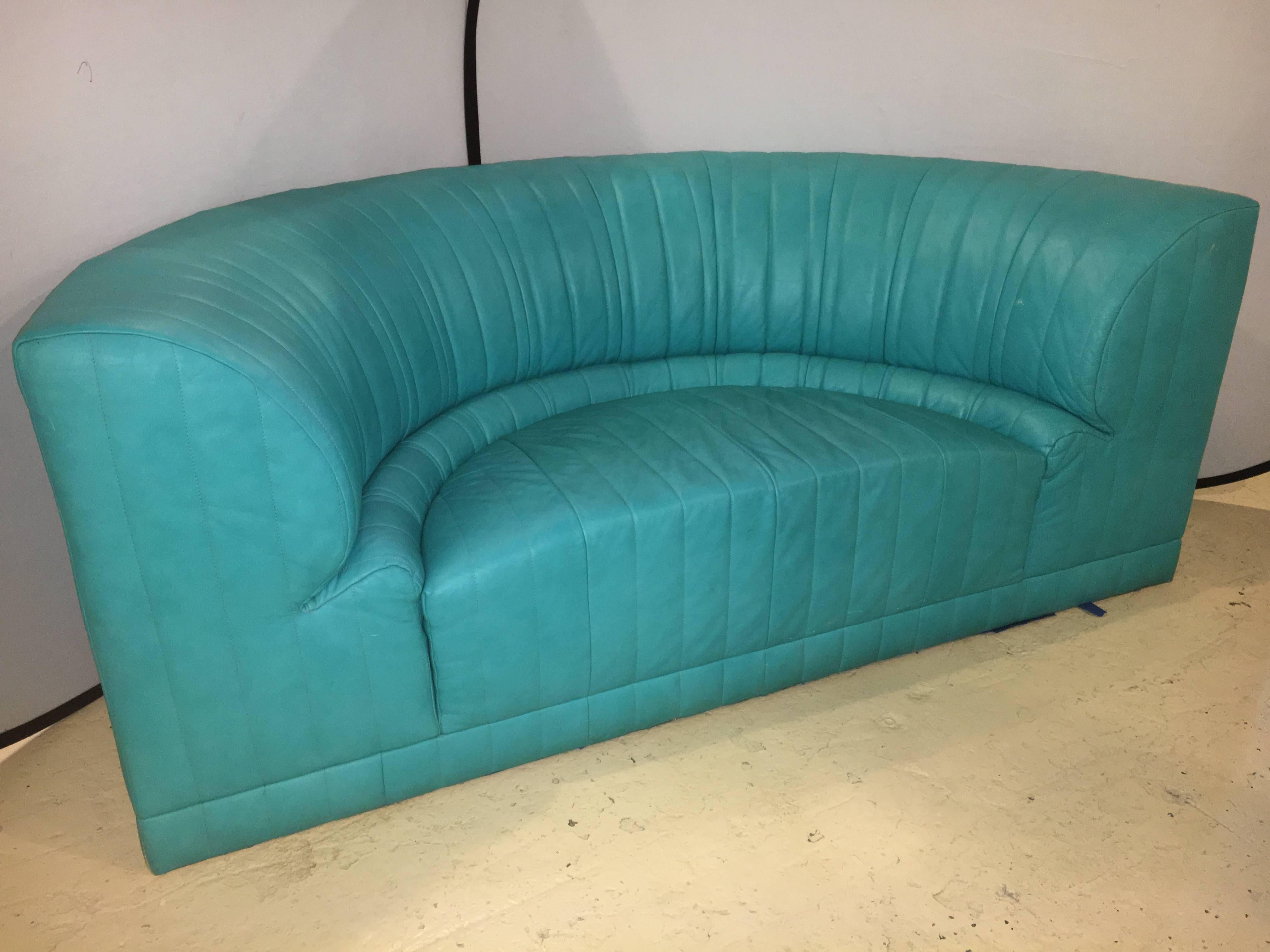 Roche Bobois semi-circular couch or settee. A wonderful sofa or loveseat by Bobois. The finest leather on a curved back loveseat that could not be more comfortable or stylish. Signed as is the matching tete-e-tete that comes with it but is sold
