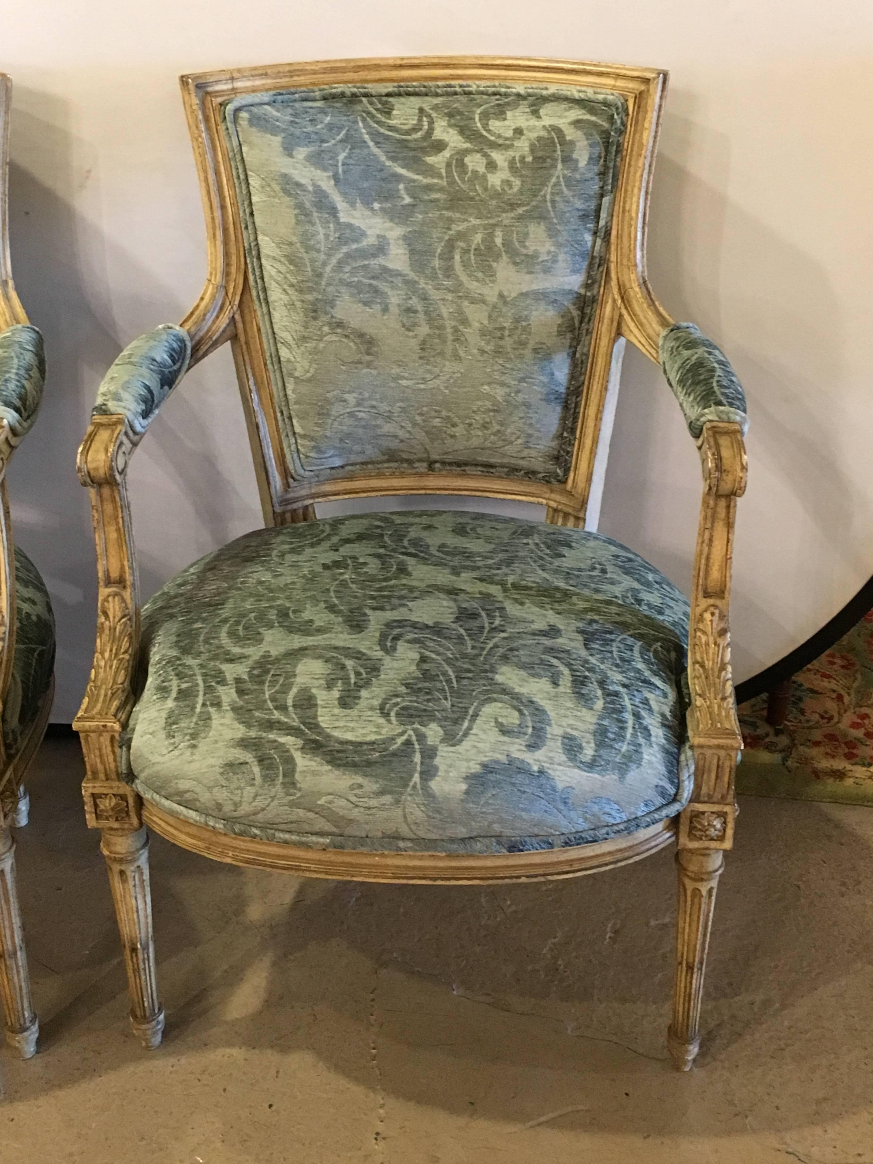 Pair of Maison Jansen Louis XVI style chairs. Finely carved and newly upholstered. The highly distressed frames are a fine depiction of the Hollywood Regency glamour that came to form in the 1940s.

This piece is accompanied by a letter of