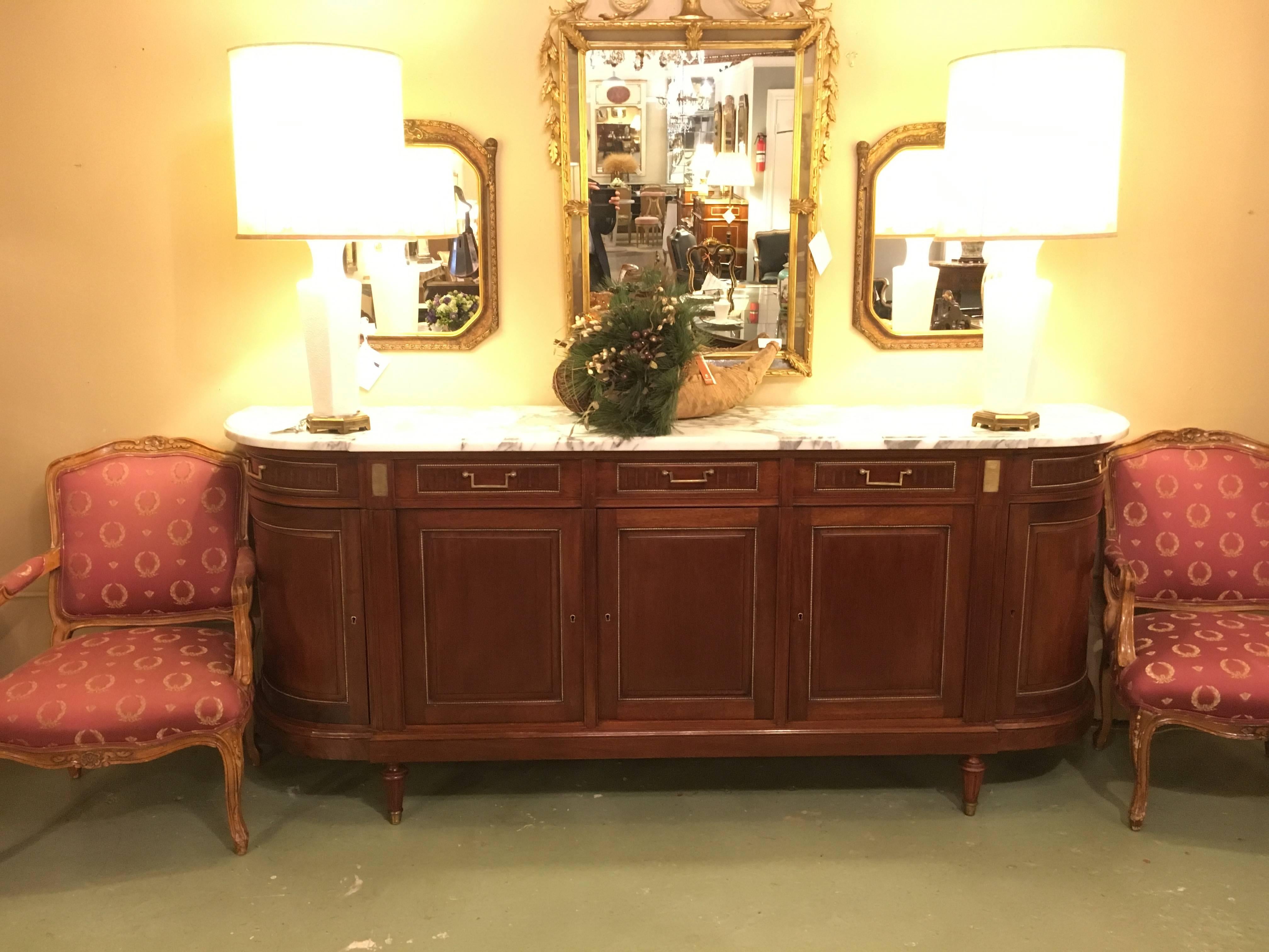Monumental Maison Jansen marble top Directoire sideboard or console table In the Louis XV fashion. This is certainly a one of a kind find that is certain to have been commissioned by someone of worth or notability by Jansen. No stone unturned in