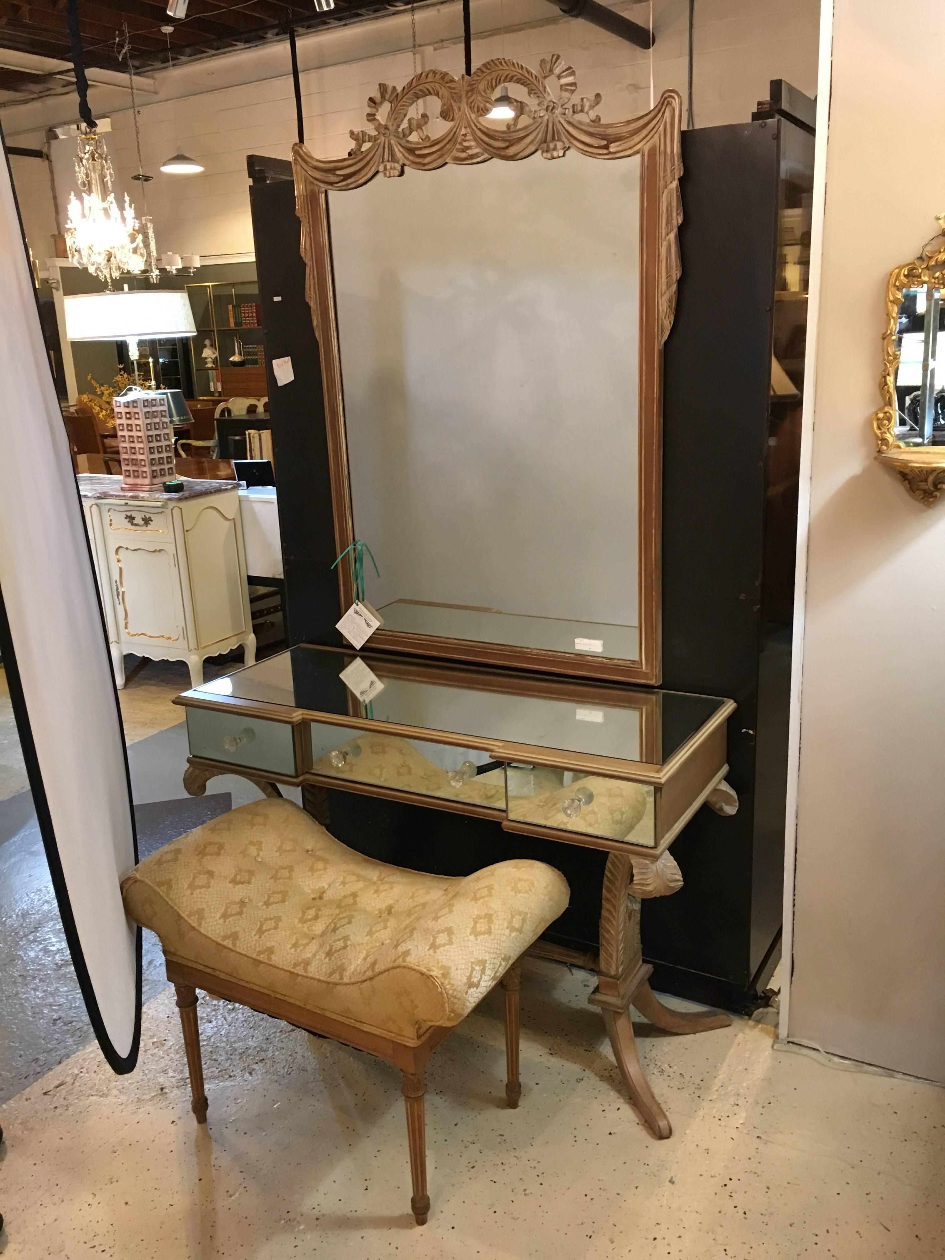 A very fine set of Grosfeld House style Drapery form mirror and Mirrored Vanity Desk w Bench. A fine Hollywood Regency mirrored and pickled finish vanity with Plume design legs. The legs supporting an apron of three mirrored drawer fronts, the