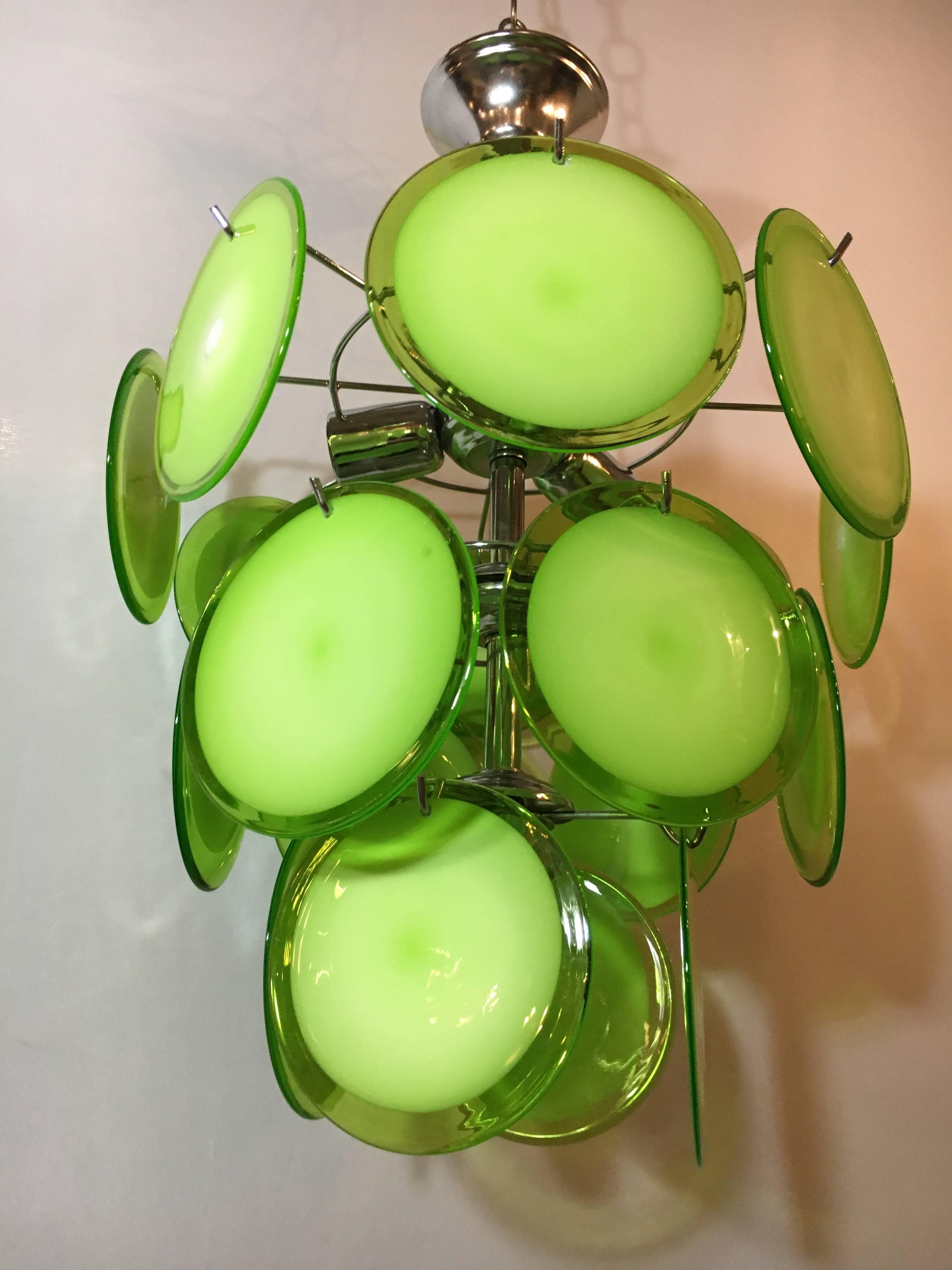 One of a group of Murano glass circular disk ceiling lights. Recently I purchased an entire warehouse consisting of thousands of Murano glass circular and shell form disks. In this group of lights, sold separately, I have several different colors