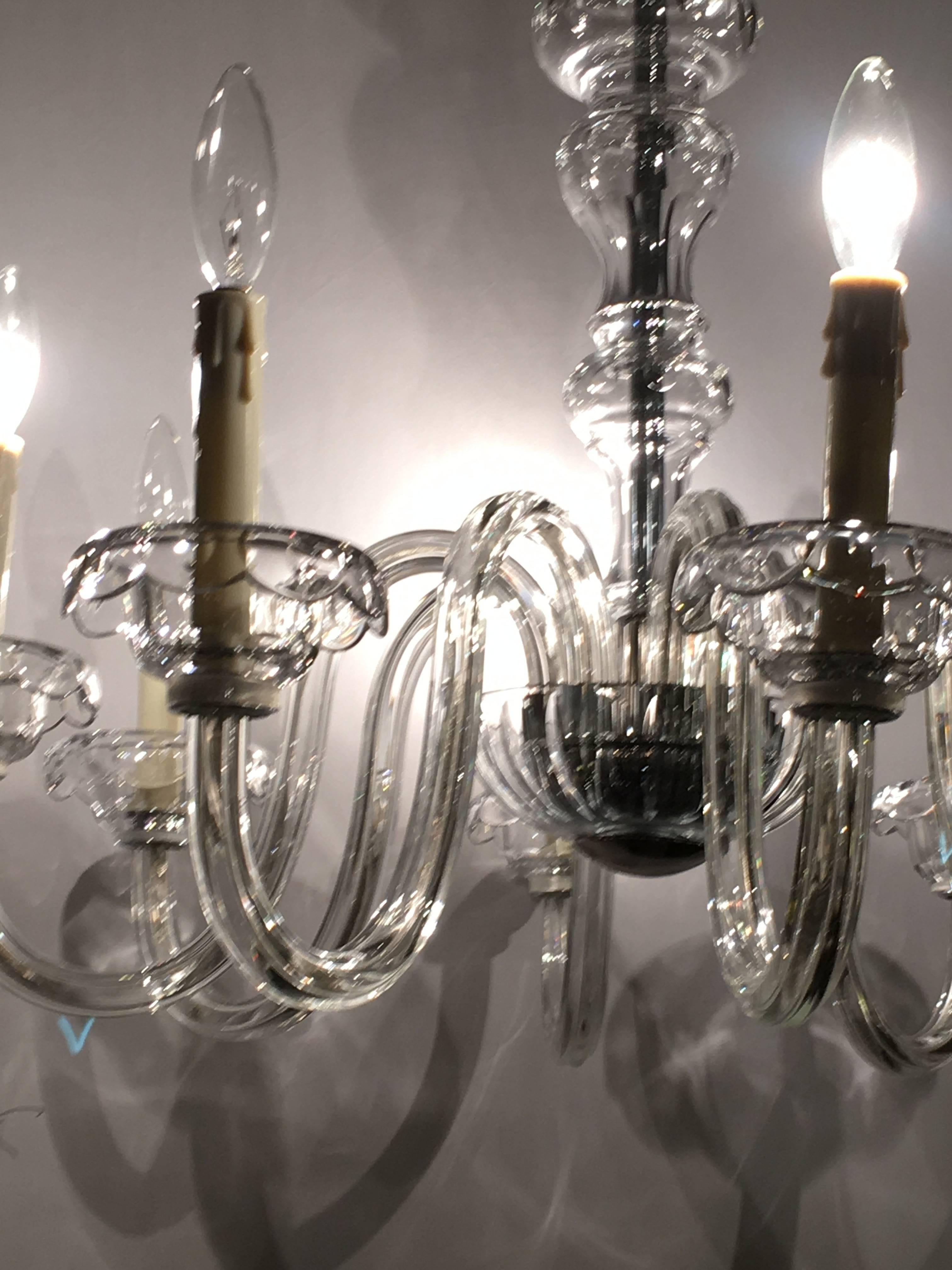Traditional Georgian style crystal chandelier. If simple and understated is what you are searching for, search no more. This elegant Georgian style chandelier has no trimmings at all. The chrome-plated ceiling plate and chain flow wonderfully onto