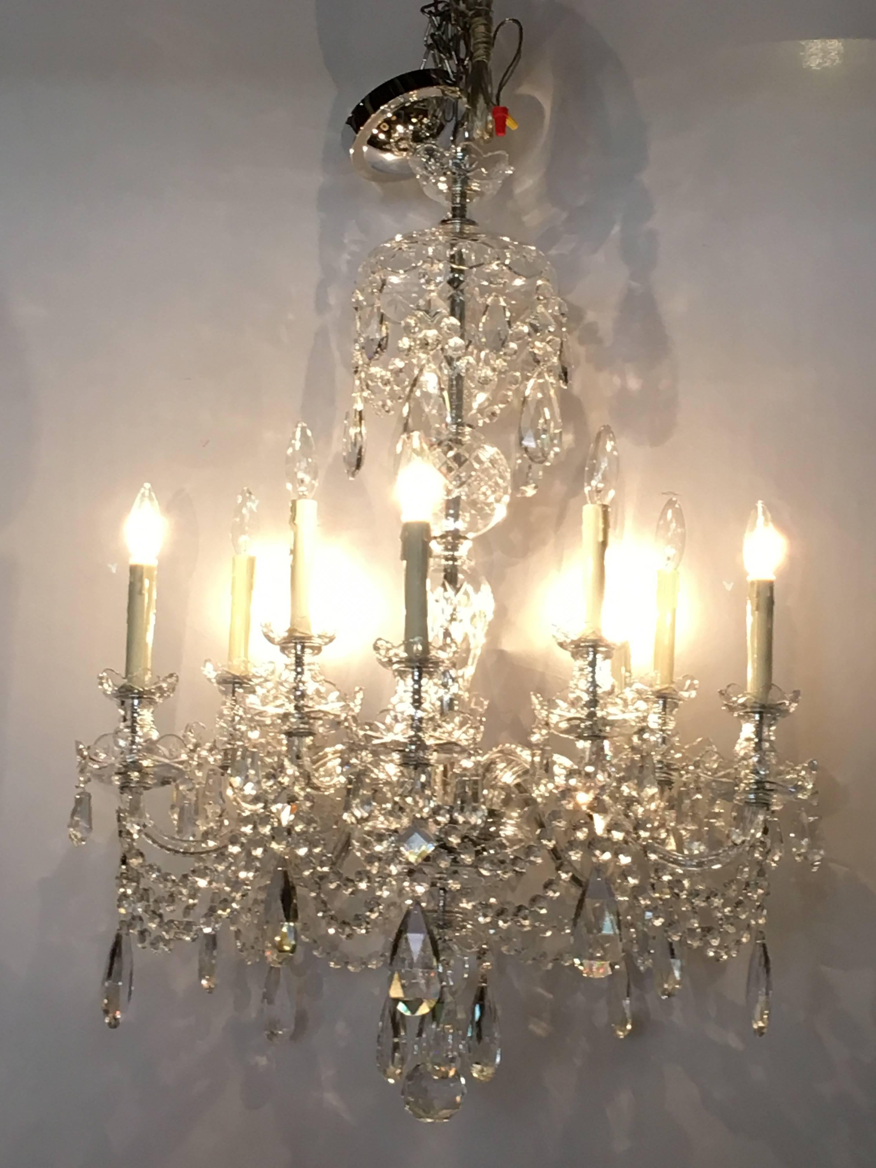 A ten-light cut crystal Georgian style chandelier. This recently re-wired and cleaned chandelier depicts the Georgian Era in its full light and grandeur. Having an enormous amount of the finest cut crystals this ten light chandelier is certain to