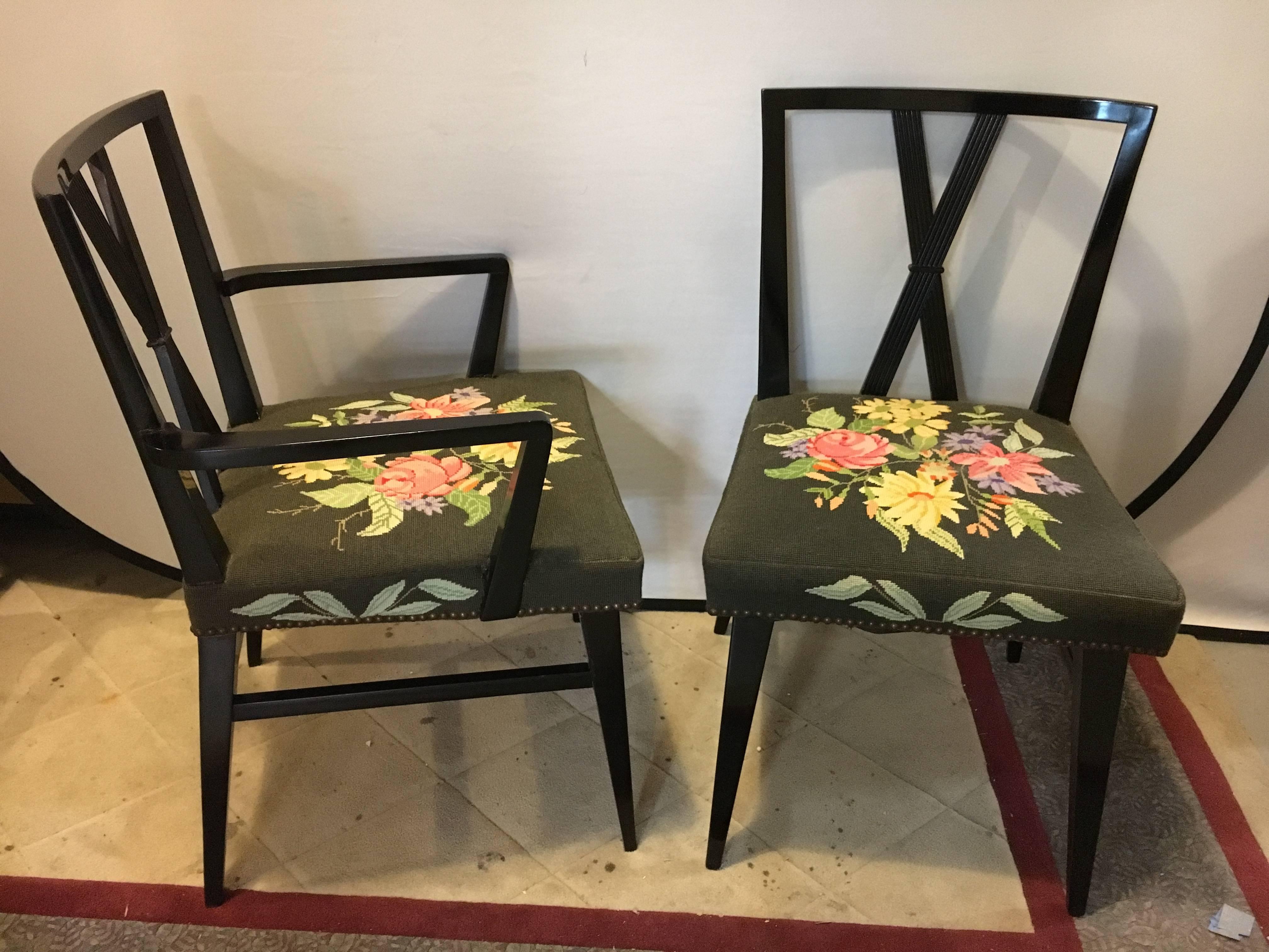 Set of eight ebonized Tommi Parzinger dining chairs. This set of eight Parzinger dining chairs is comprised of a pair of Armchairs and six side chairs. All in a handwoven needlepoint upholstery. Each seat is signed and dated 1970. The frames are all