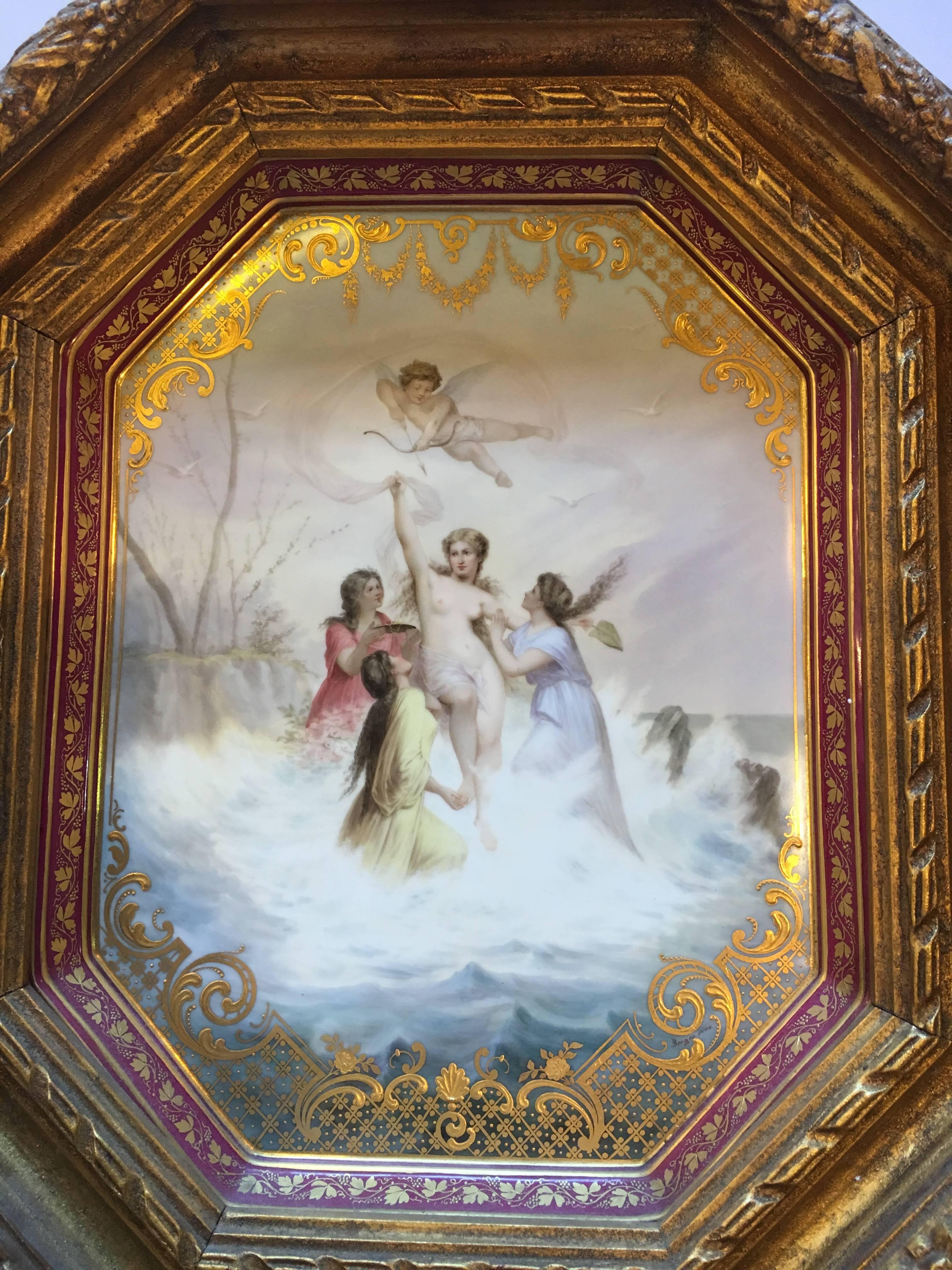 A Vienna style porcelain burgundy-ground tray, 'triumph Der Venus' late 19th century, blue beehive mark, signed bergère Pinh. The oblong octagonal tray painted with Venus rising from the sea, assisted by three attendants, cupid hovering above them,