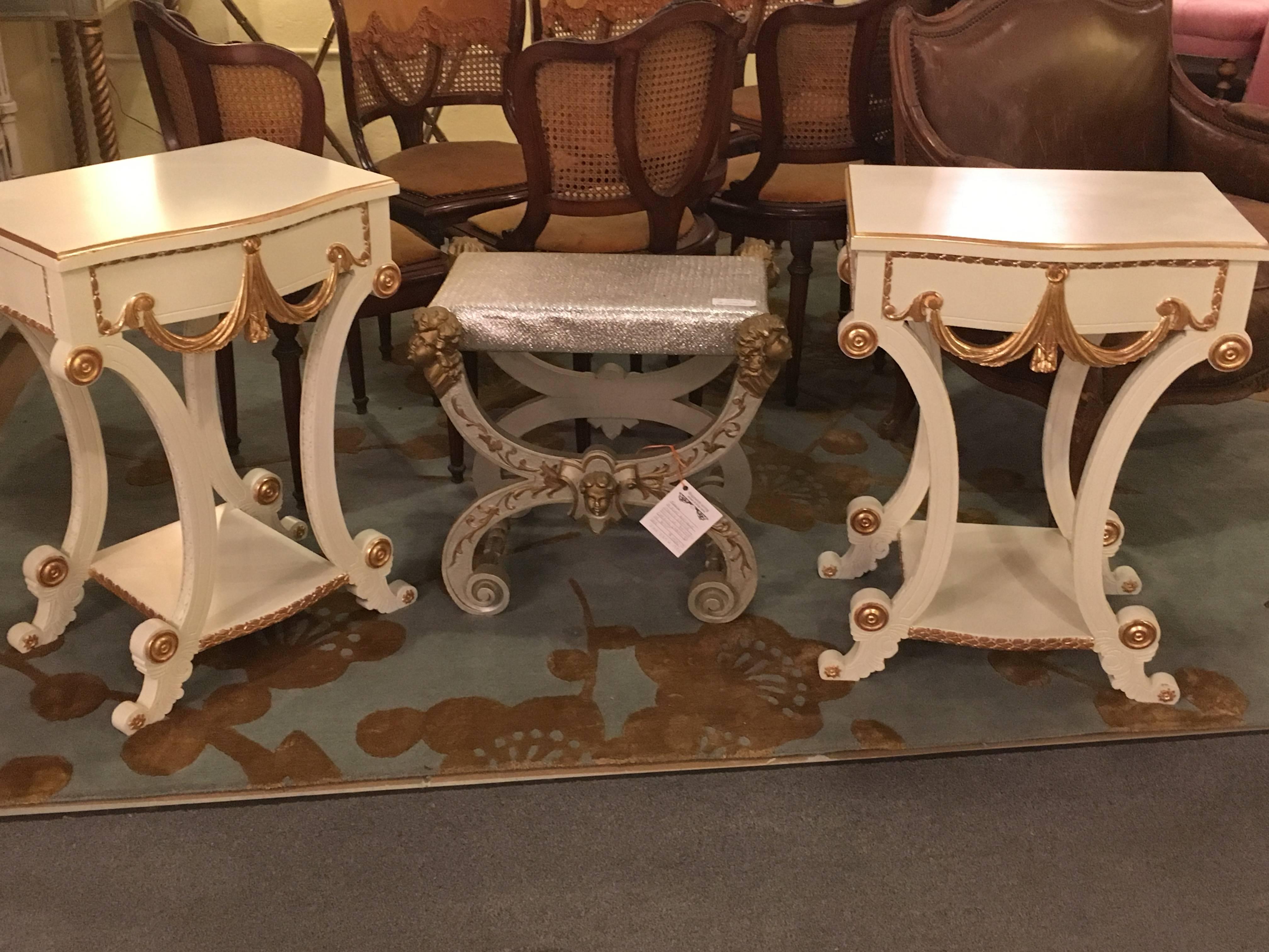 Pair of Grosfeld House Hollywood Regency paint and gilt decorated end tables or nightstands. This wonderfully decorative pair of end tables have been professionally redone in a Lancaster white finish with hand applied gilt gold high lights. Standing