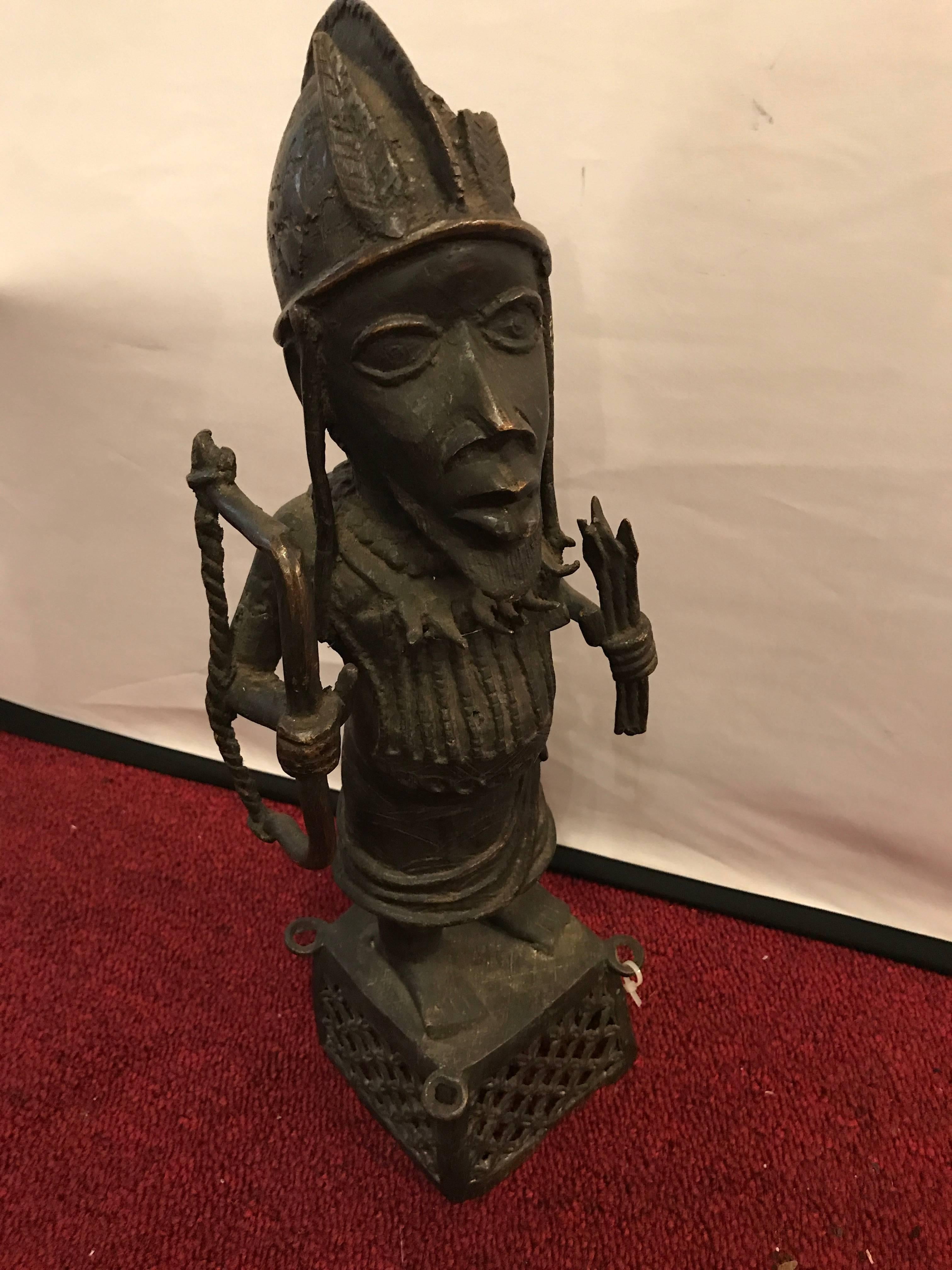 19th century Benin bronze. This finely chiseled bronze fellow stands 19 inches high.

The Benin bronzes are a group of more than a thousand commemorative metal plaques and sculptures that decorated the royal palace of the Benin Kingdom in