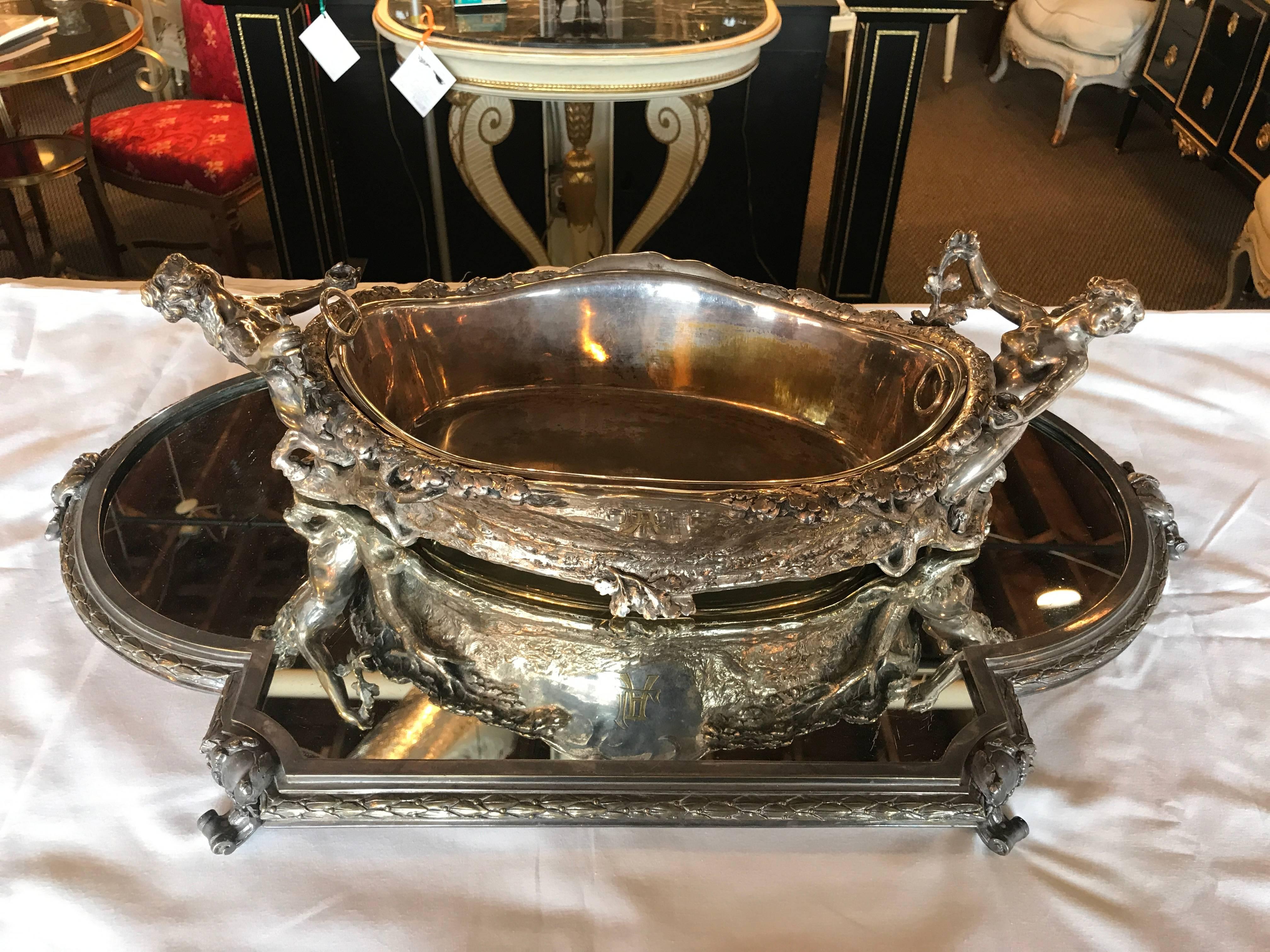 Christofle platter and center piece. The measurement for the bowl is 19.5 inches width 9.25 inches depth 5.5 inches height and the measurement for the platter is 26.25 inches width, 17 inches depth and 2 inches height.