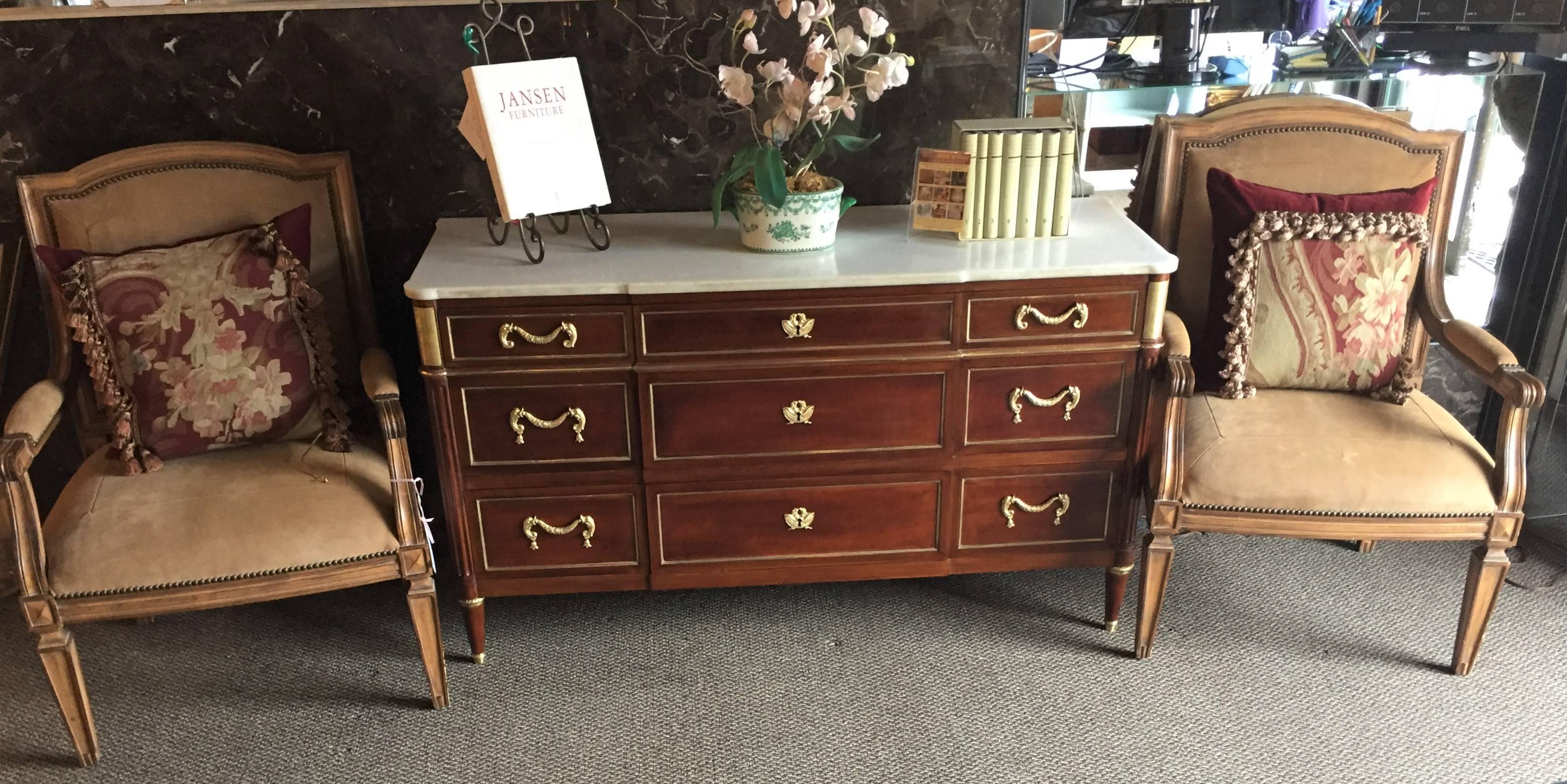 A Maison Jansen Louis XVI style commode or chest. This is quite simply one of the finest by this highly sought after designer. The short tapering feet with bronze sabots each terminate in circular bronze caps, supporting this nine drawer chest of