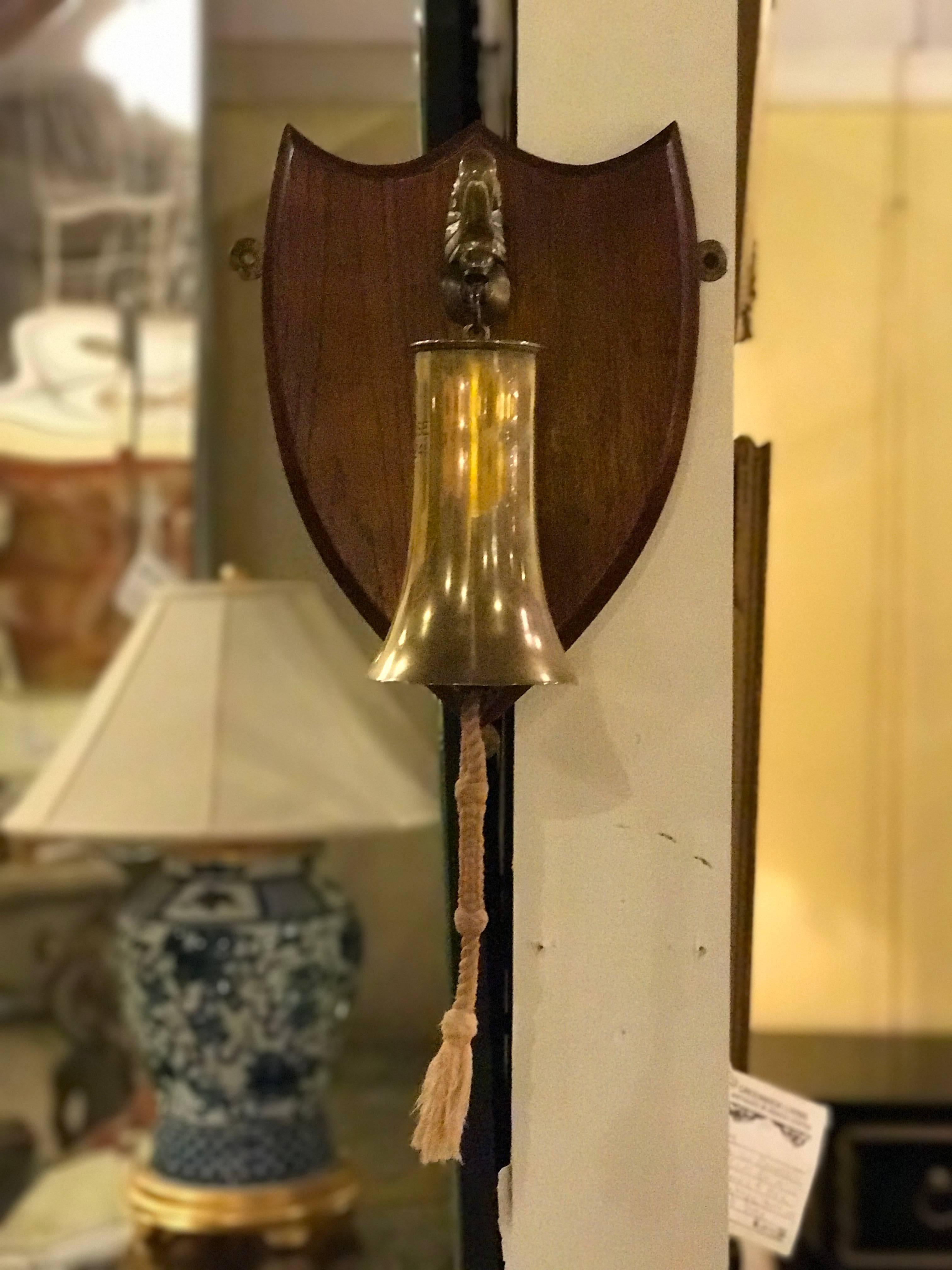 A mounted ships bell made from Artillary Shell. Signed.