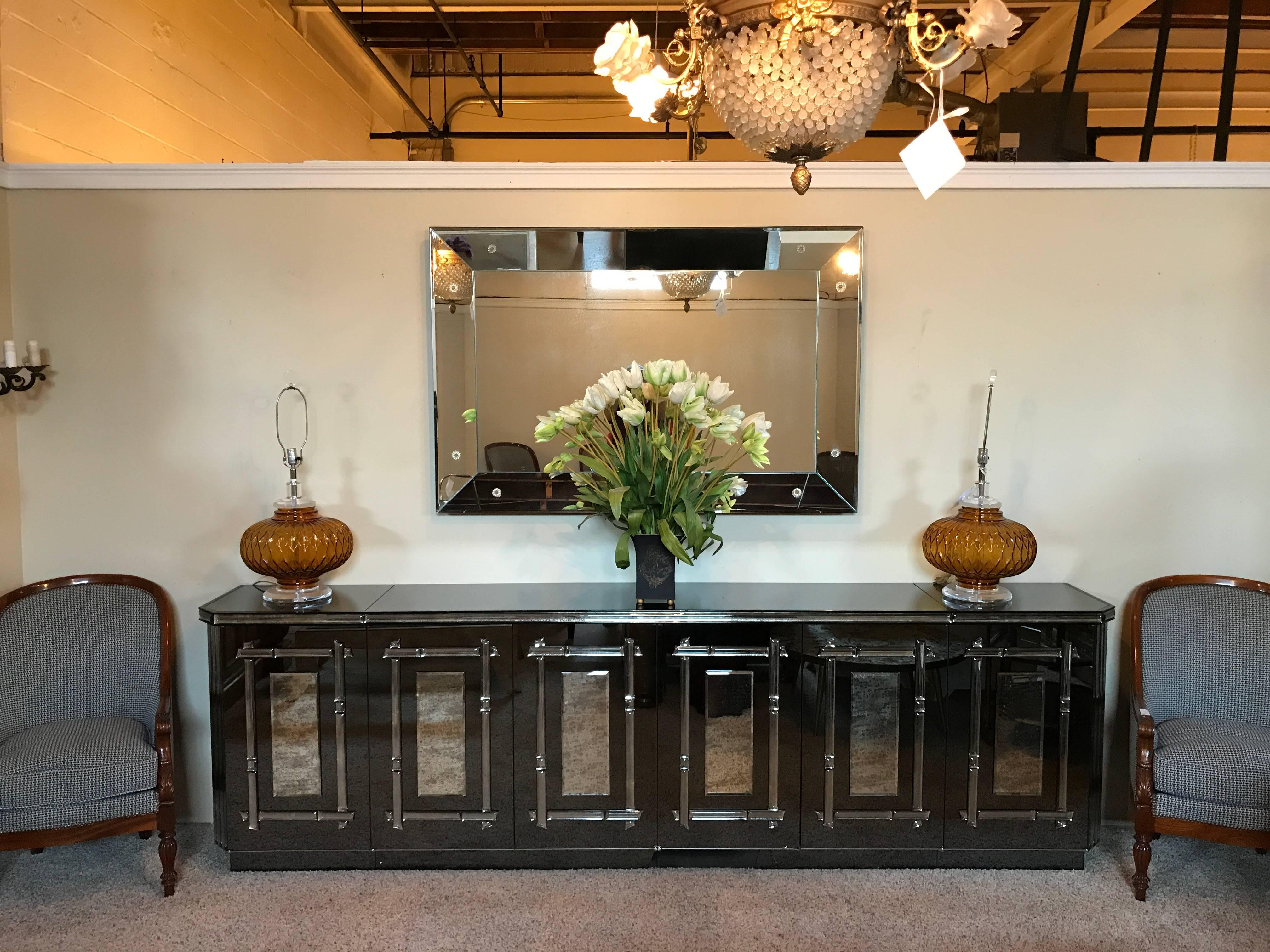Custom quality Palatial Hollywood Regency all mirrored sideboard cabinet. This fine custom quality piece brings Hollywood Recency to a new level. The all antiqued beveled mirror sideboard comes in three pieces with two side cabinet having drawers