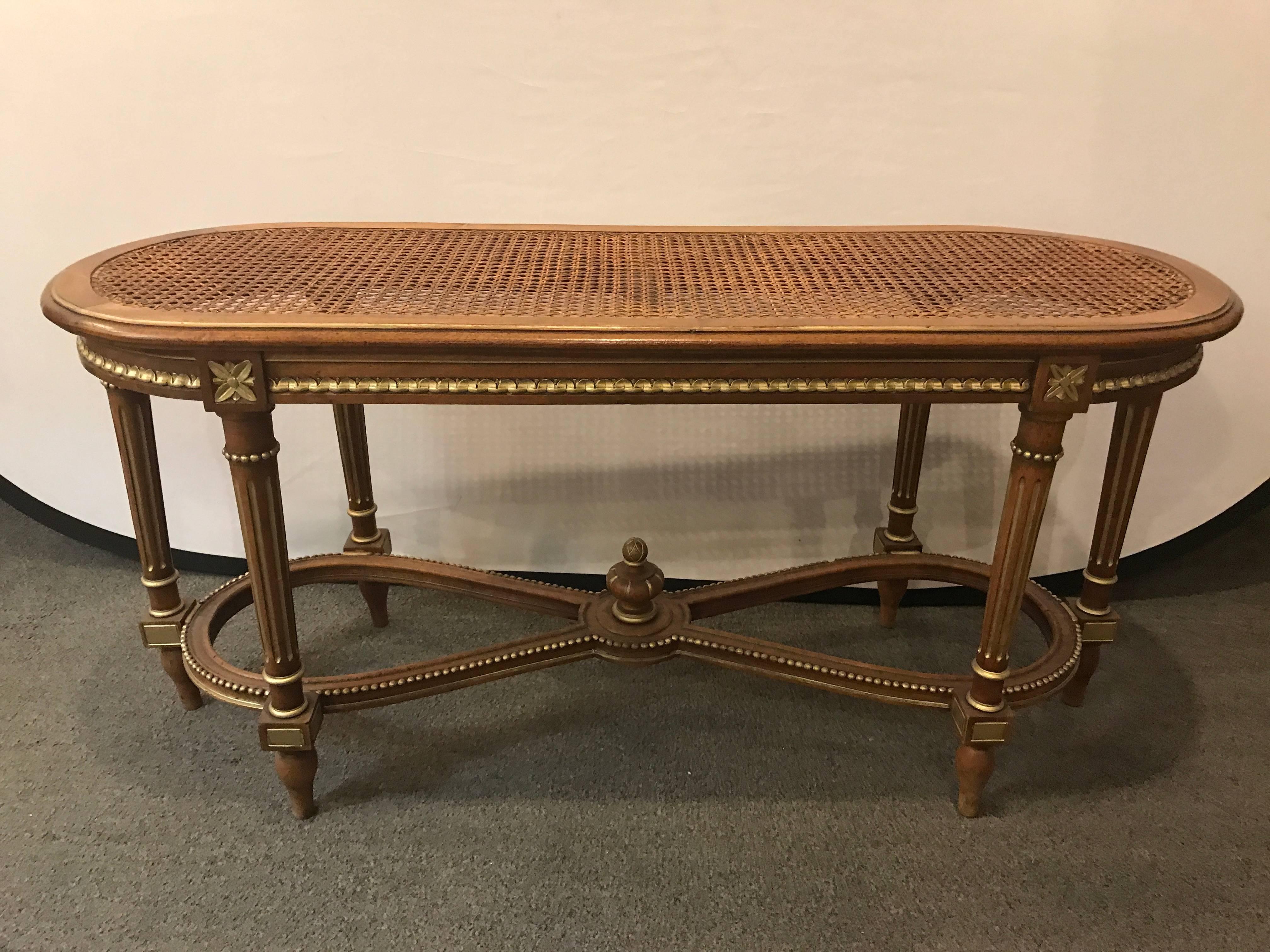 French carved Cain seat Louis XVI style bench or window seat. Having gilt gold decorative hi lights.