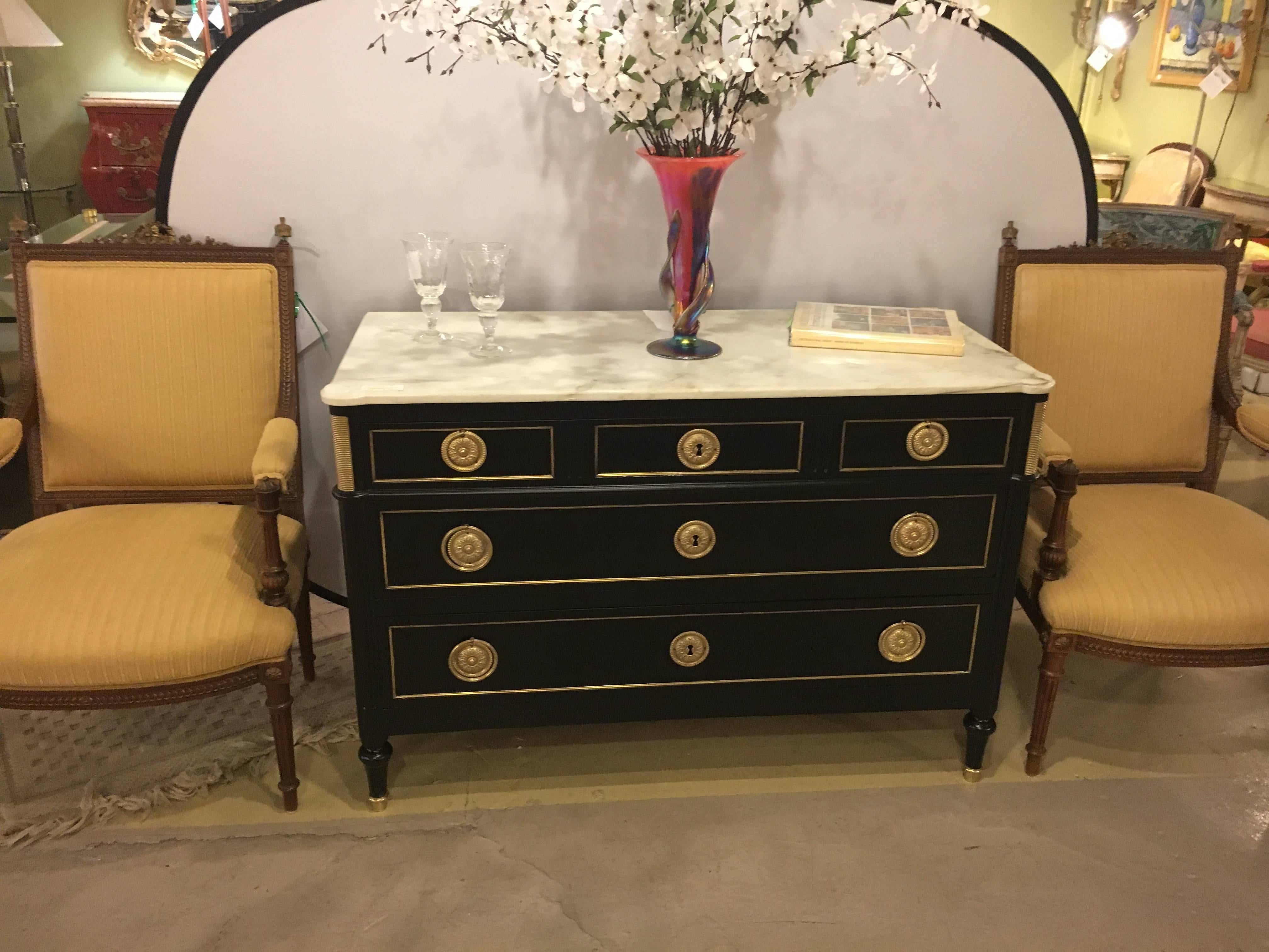 Ebonized Maison Jansen Louis XVI style mounted commode with bronze mounts. A fine ebony and gilt decorated Louis XVI Style commode or chest of drawers by this highly sought after designer. The bronze sabot feet of tapering design terminating in a