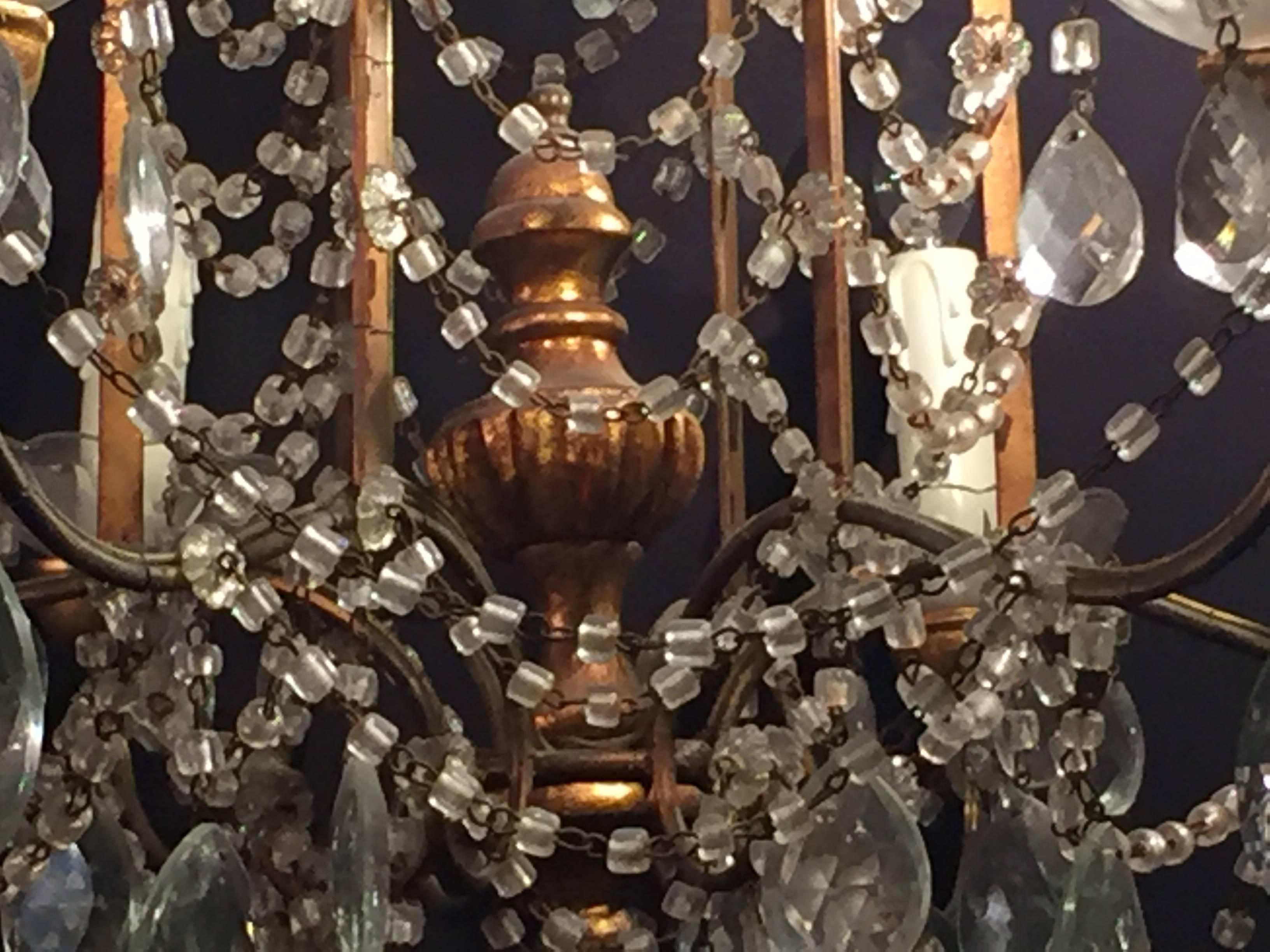 20th Century Pair of 1920s Crystal and Gilded Wood Italian Chandeliers